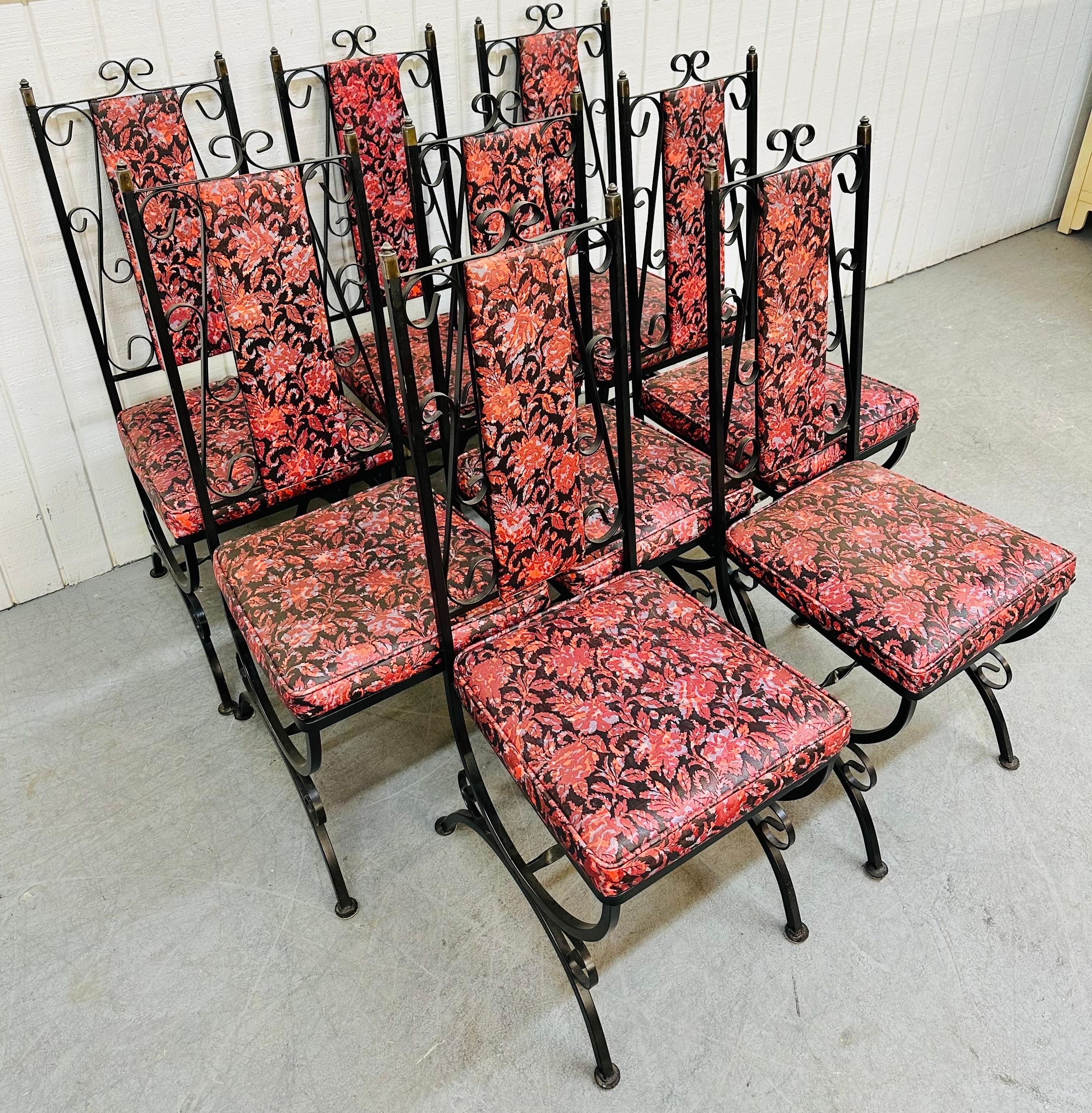 This listing is for a set of eight vintage Wrought Iron Patio chairs. Featuring eight straight chairs, wrought iron frames, original black and red floral upholstery, and brass caps at the top of each chair. This is an exceptional example of quality