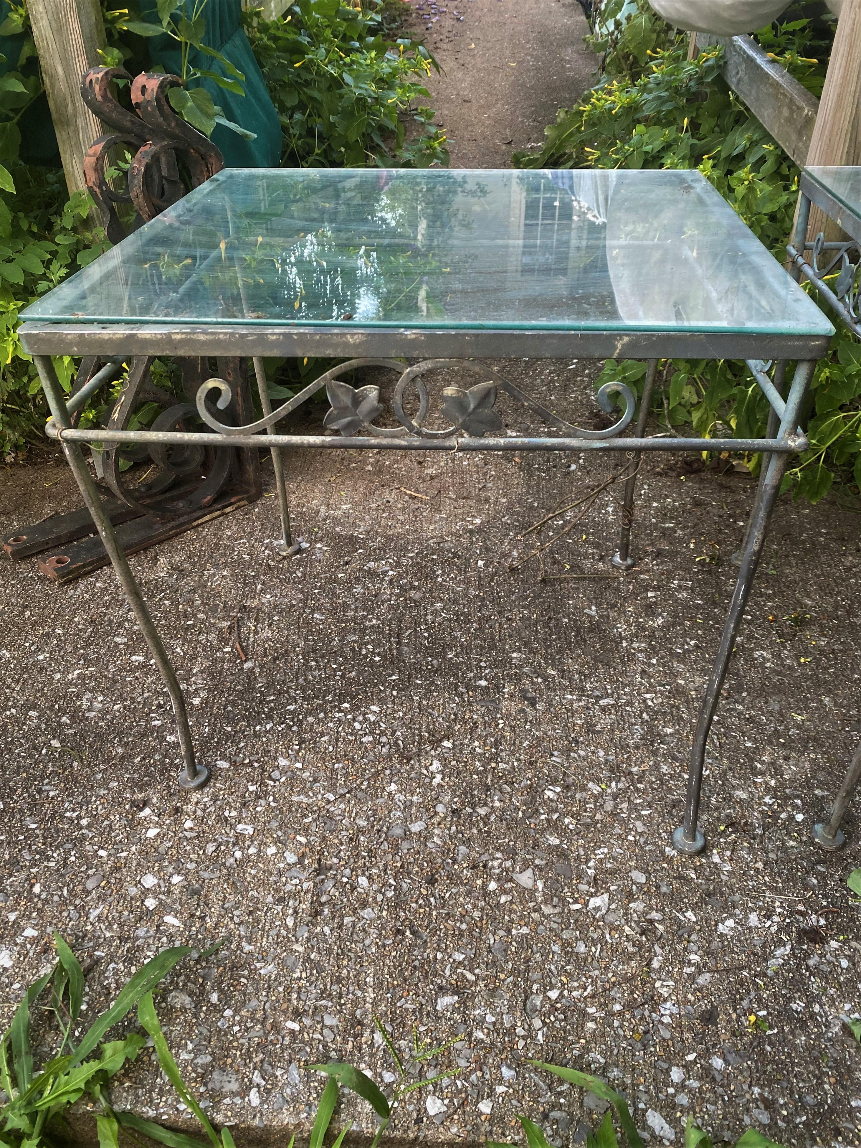 Here are a nice, classic pair of matching wrought iron side or end tables which can be used in many ways. They were originally made for outside or porch use but I love when outside furniture  is used inside. The tables are in good shape, both have