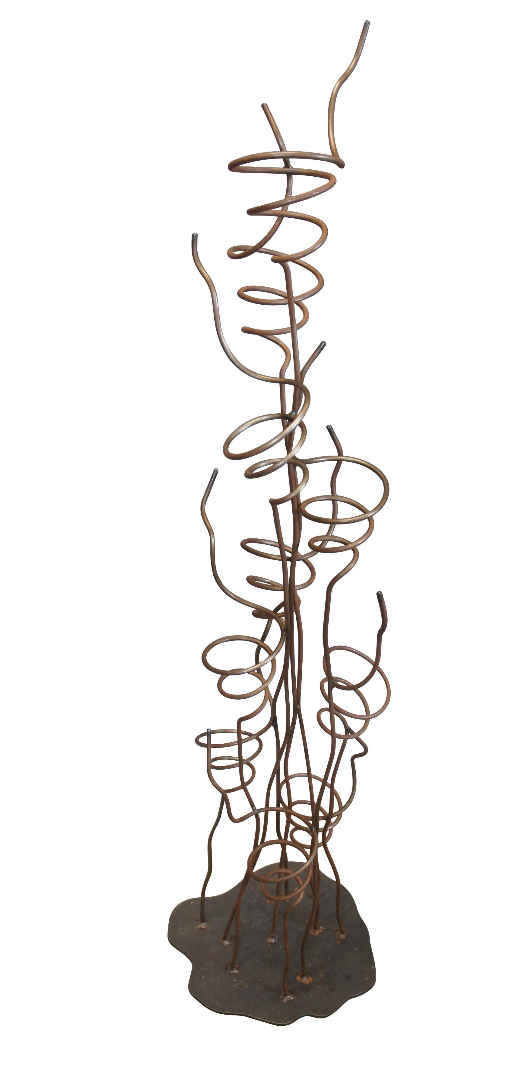 Mid to Late 20th century abstract Brutalist / post modern sculpture / wine tree display rack.  Made of wrought iron featuring a freeform base that supports 10 independent twisted iron bottle holders.

Dimensions:
13