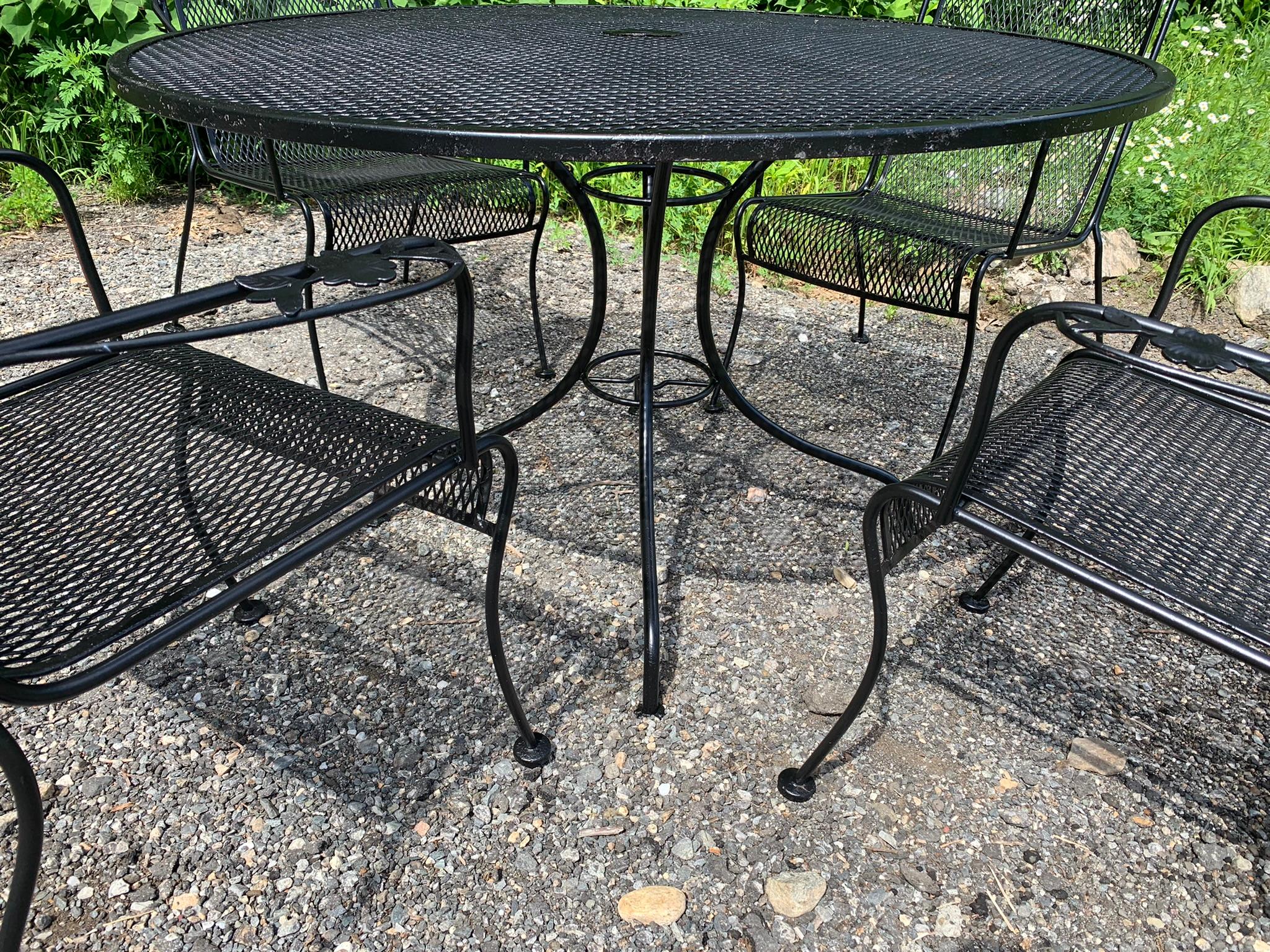 Vintage wrought iron seating - set of 4 chairs and 48” table

Woodard Salterini wrought iron pedestal table with removable top. Mesh chairs and table top. Perfect addition to any deck, garden, or patio. Sandblasting and powdercoating upon request.