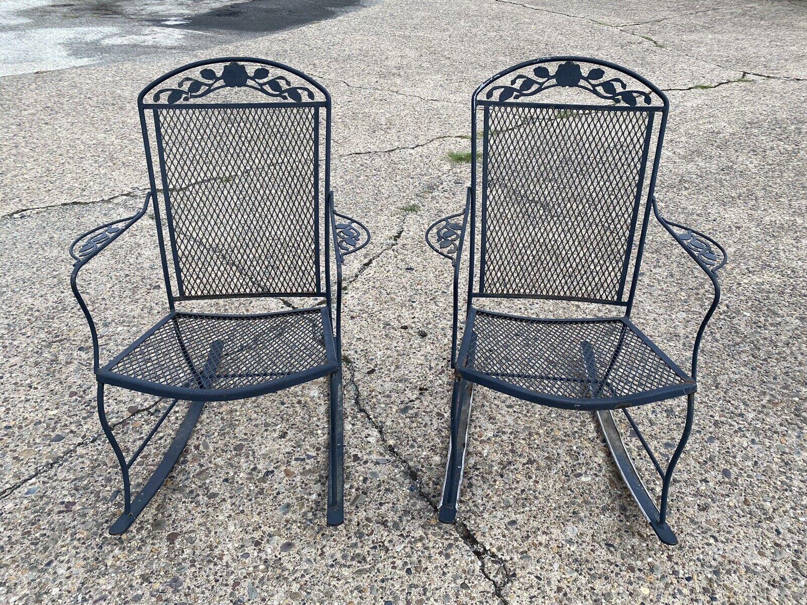 Vintage Wrought Iron Victorian Style Garden Patio Rocker Rocking Chairs - a Pair. Item features wrought iron construction, very nice vintage pair, great style and form, possibly Meadowcraft Dogwood pattern. Circa Mid to late 20th Century.