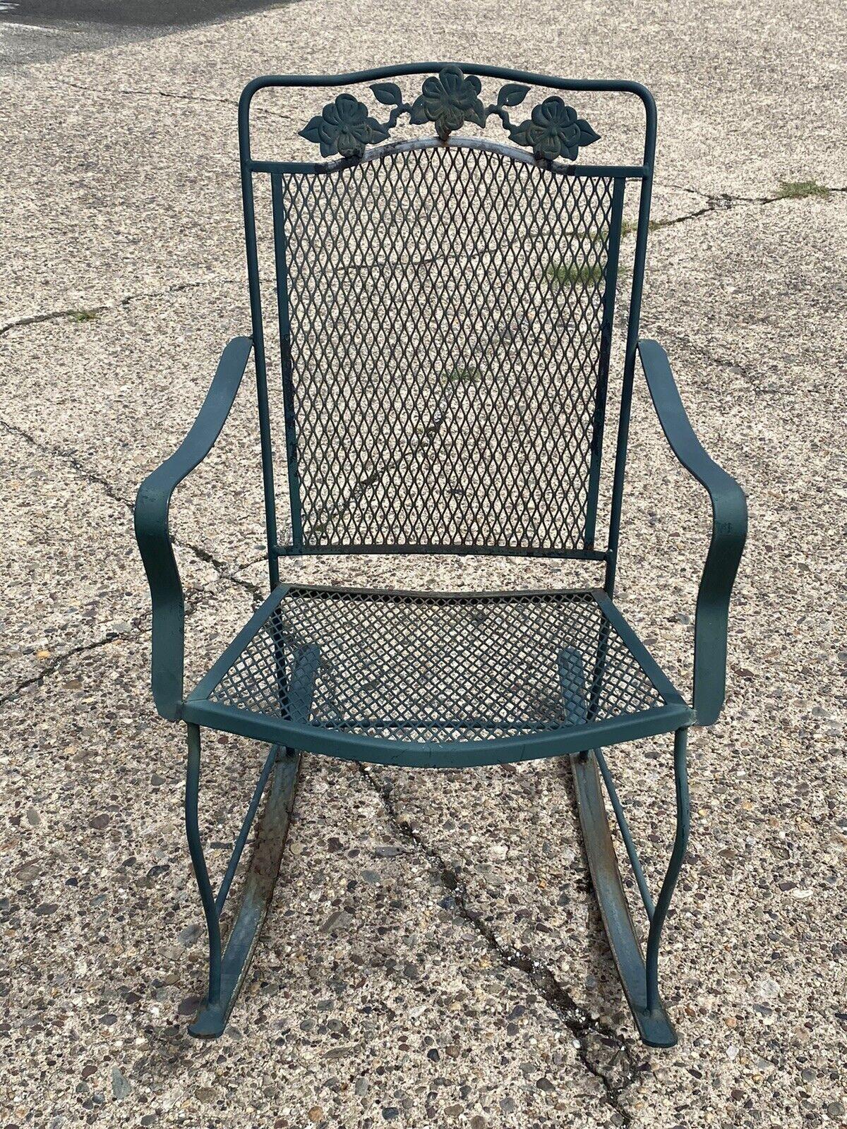 Vintage wrought iron Victorian style green garden patio rocker rocking chair. Item features wrought iron construction, very nice vintage item, great style and form, possibly Meadowcraft Dogwood pattern. Circa mid to late 20th century. Measurements: