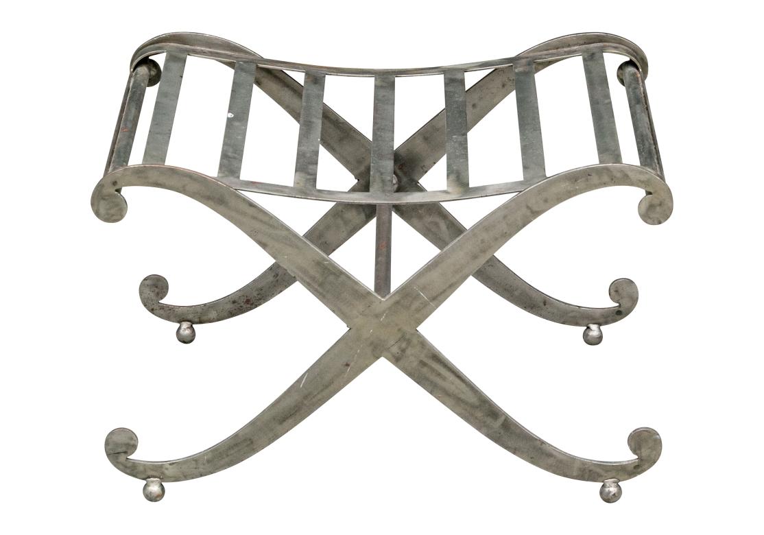 A strong and decorative steel bench with curved top and X form frame and scrolled ends on ball feet. With an incurved slatted seat and center stretcher. Solid feeling with good weight and comfort. 

Dimensions: 24 1/4