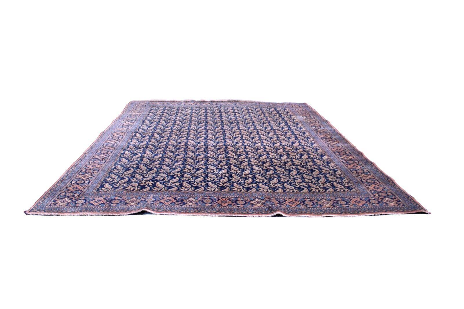 This beautiful Persian rug is hand-knotted. It is made from 100% hand-spun wool and natural dyes. The colors on the rug are vibrant, and the intricate pattern is unique to the region it was made. The rug has a soft, plush pile that is perfect for