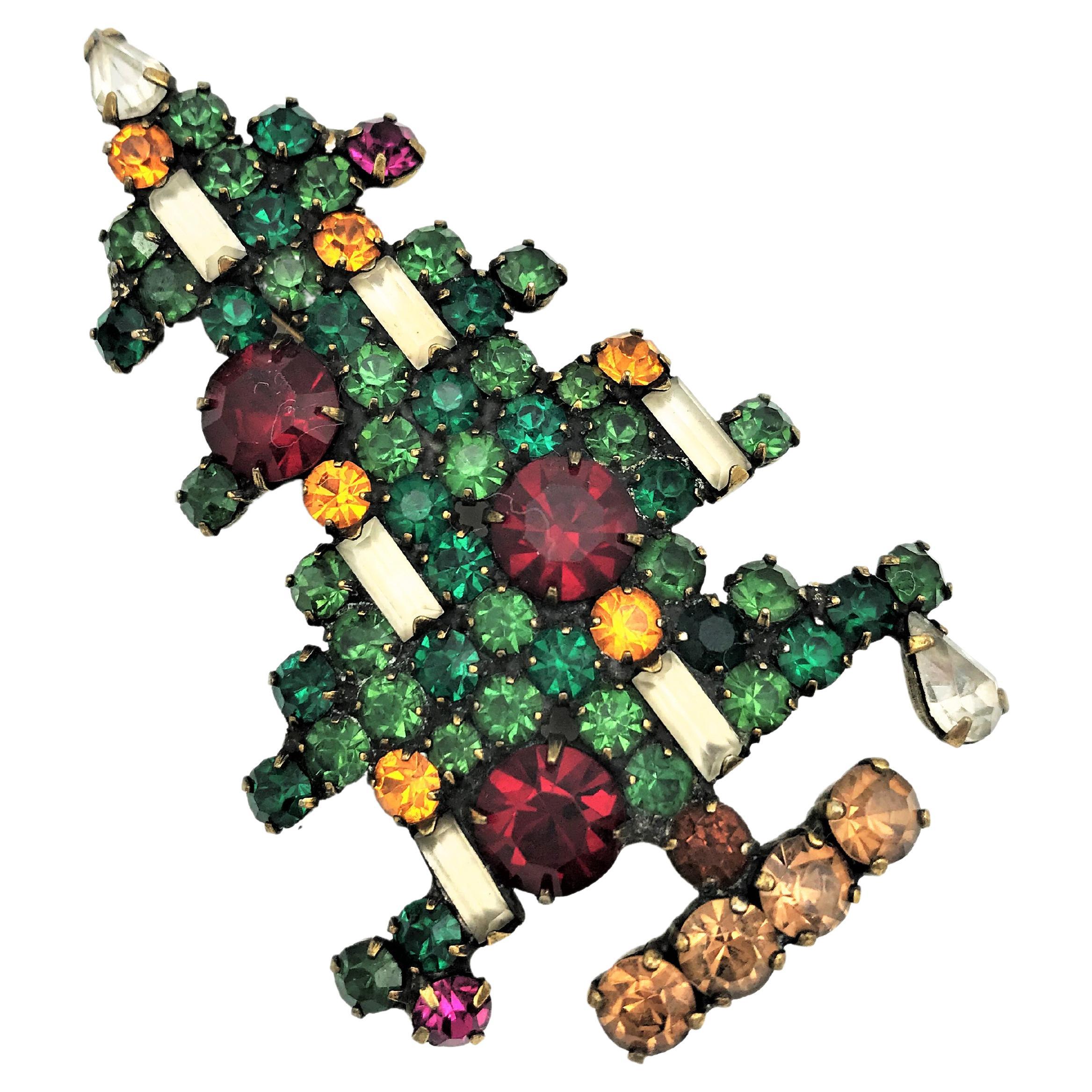 Christmas is coming soon! 
The most beautiful vintage Christmas brooch from the 1940s is the tree from WEISS made in  the US. Entirely set with cut rhinestones from Swarovski. All rhinestones are prong set. 
Measurement: Hight 7 cm, Width 4 cm. The