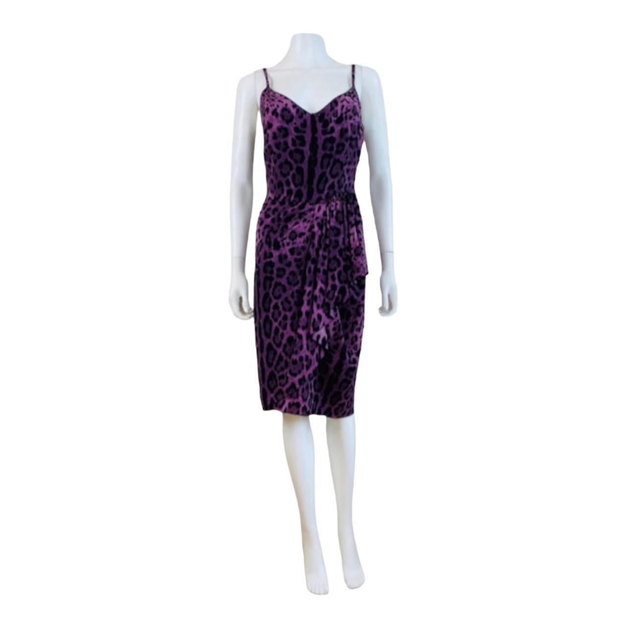 Vintage Y2K Dolce + Gabbana Dress
Purple + black leopard print silk + elastane fabric
Sleeveless style
Thin shoulder straps
Fitted bust with V neckline
Fitted waist with draped hip swag on the left hip
Knee length/midi length tapered skirt
Hidden