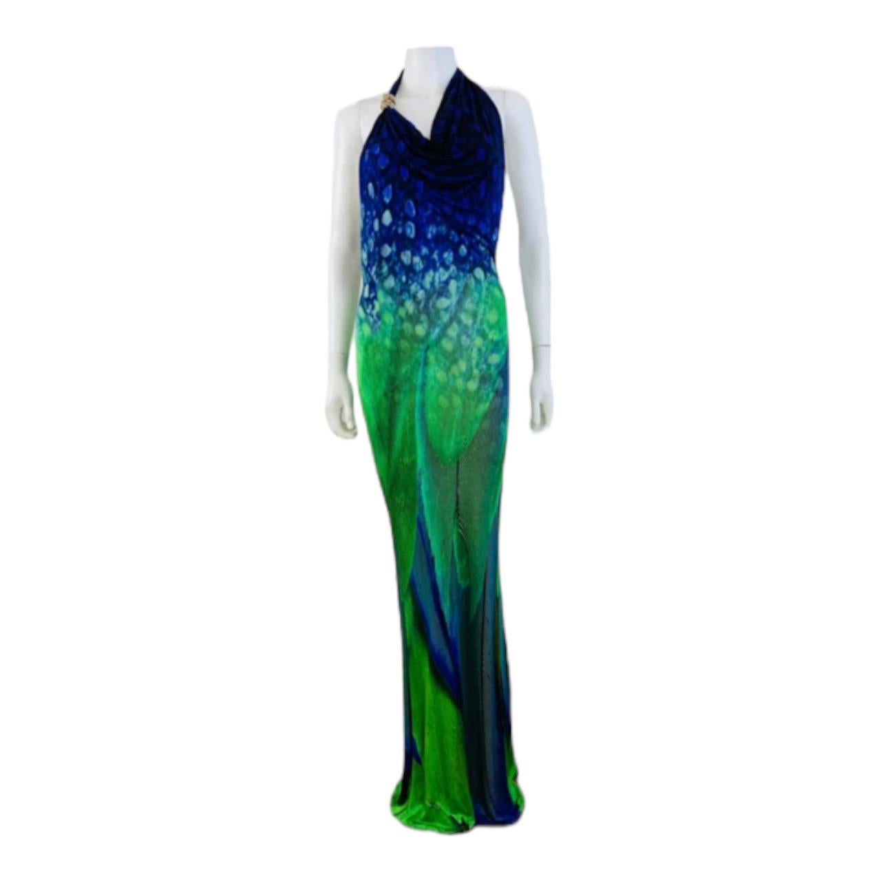 Stunning Roberto Cavalli Dress
Incredible + bold oversized peacock feather print
Green + purple colors meld together for an ombre effect
Halter neckline with gold accent snake brooch
Draped neckline
Built in elastic bottom bra
Fitted wiggle