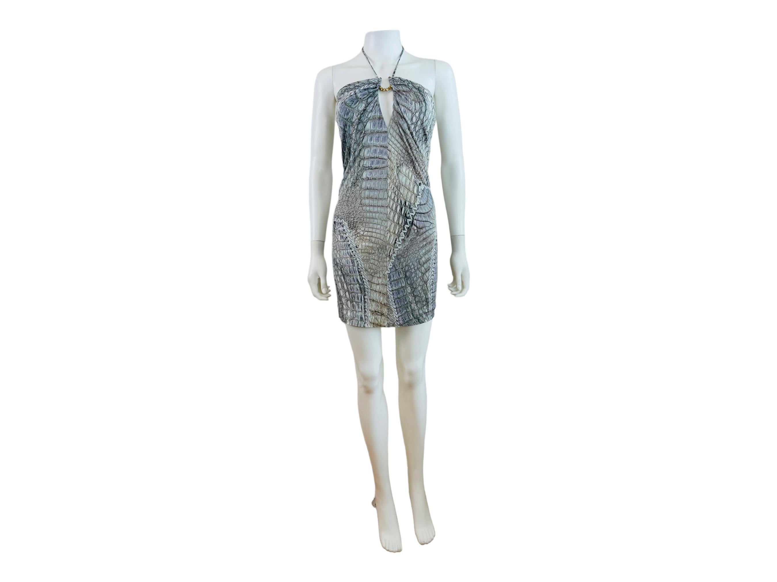 Vintage S/S 2011 Roberto Cavalli Dress
Crocodile + stitch print
Halter neckline with gold hardware at the neckline + keyhole cut out
Thin straps tie at the back of the neck
Mini length
Fully lined
Slips on overhead

Size not marked, Fit like a