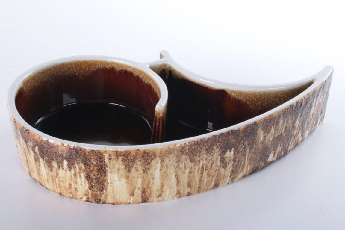 Vintage Yamasan Ikebana Bowl Beautiful Ceramics from Japan, 1960s

Vintage Ikebana bowl from Yamasan.

The glaze has a rich brown color and resembles highly grained tree bark.

Ikebana is the art of Japanese flower arranging and this bowl would fit