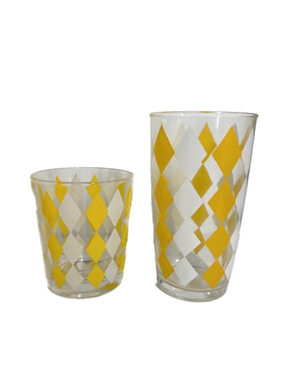 Fourteen-piece, mid-Century Modern cocktail set with alternating columns of yellow and white diamonds on clear glass.

1 - Cocktail shaker: 10