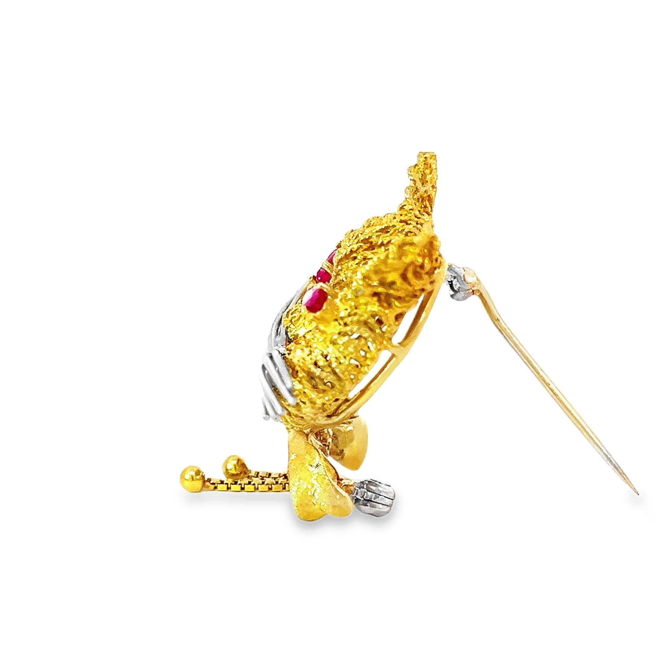 Vintage cat brooch crafted from 18-karat textured yellow and white gold whiskers. The brooch is accented by white gold whiskers, giving it an extra layer of detail and refinement. The yellow gold cat's unique design mimics the texture of cat hair.