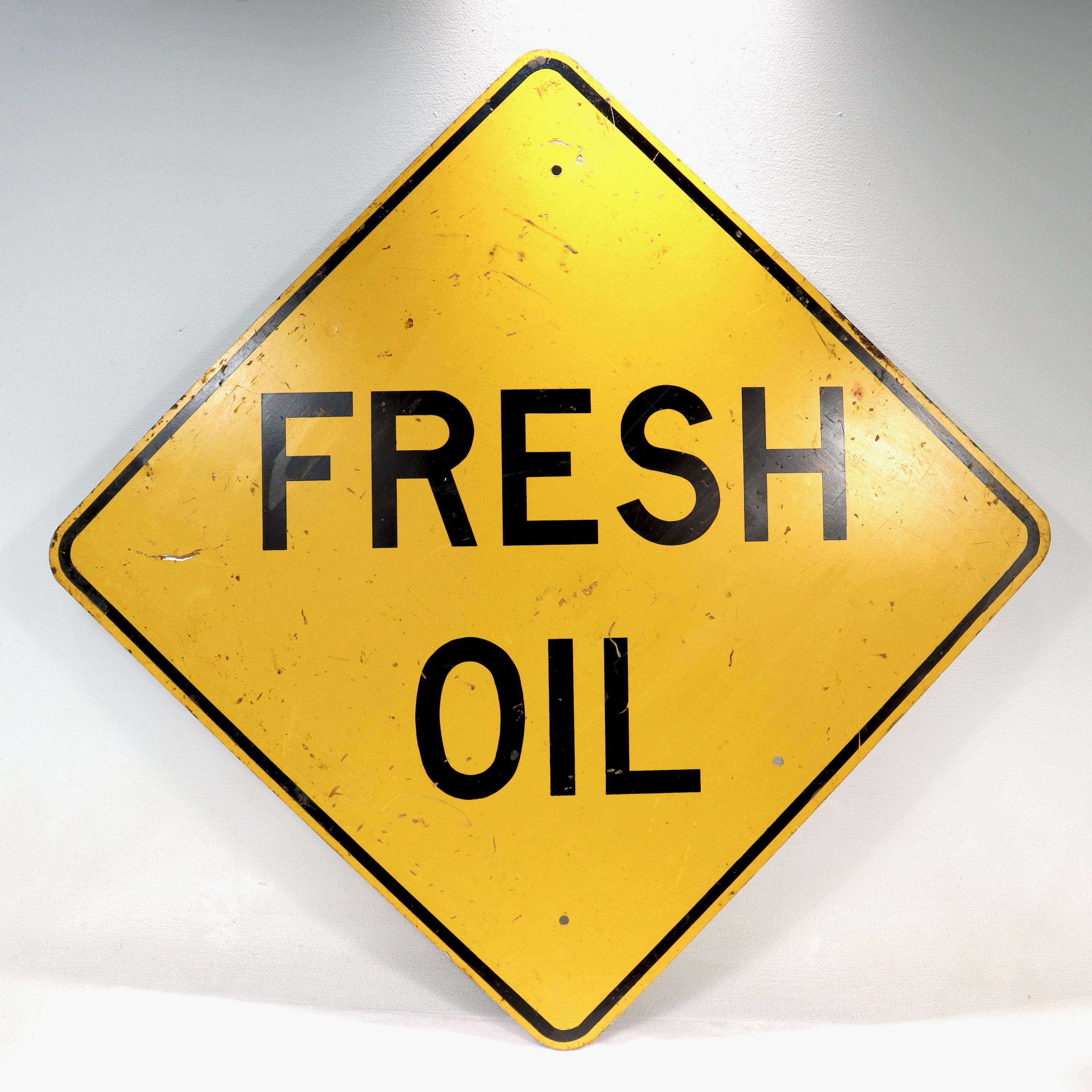 A fine vintage traffic or street sign.

With text that reads: FRESH OIL.

In reflective yellow paint.

Simply a great vintage sign! 

Date:
Mid to Late 20th Century

Overall Condition:
It is in overall good, as-pictured, used estate
