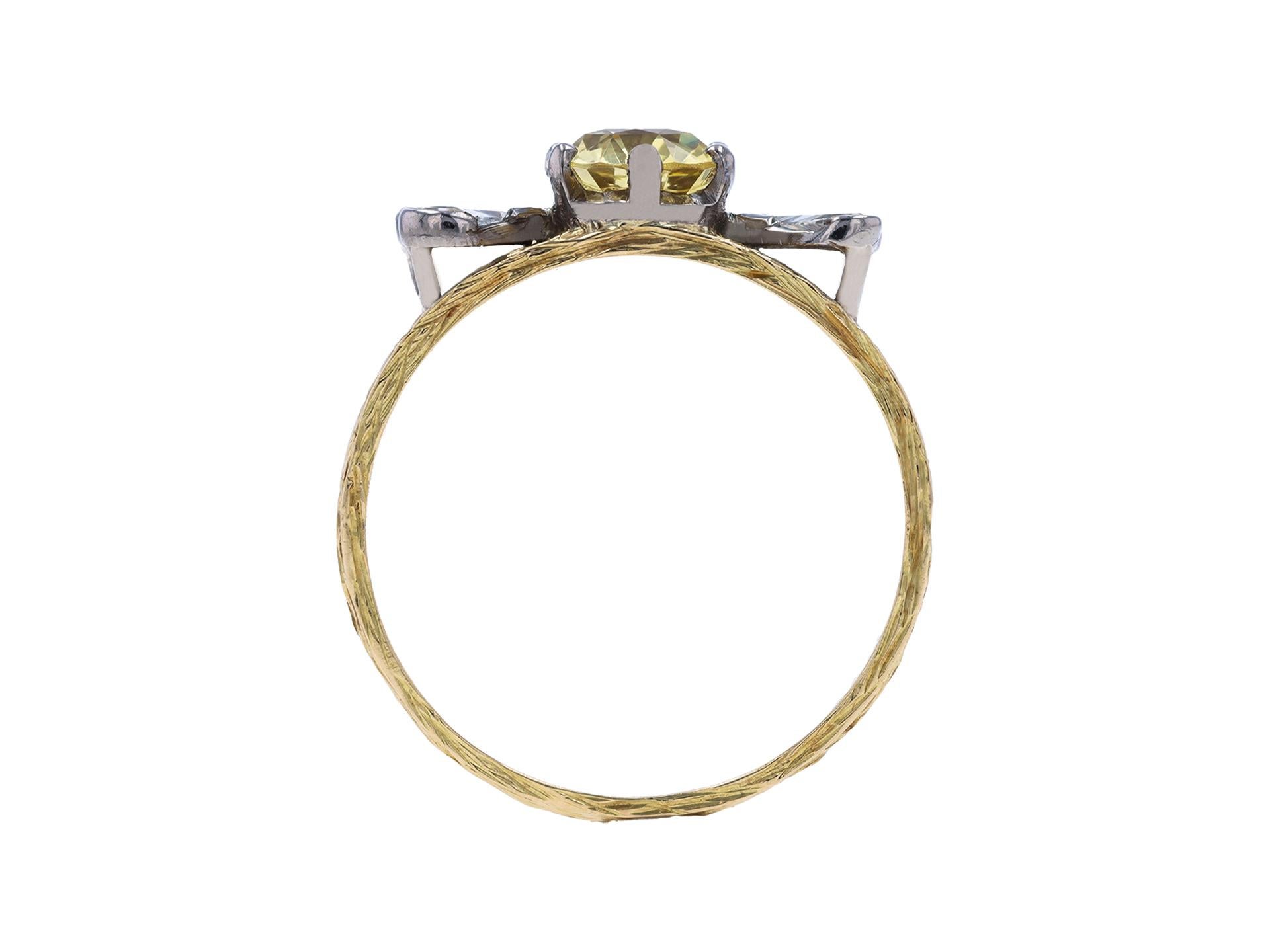 Vintage yellow Ceylon sapphire and diamond three stone ring. Set to center with an oval shape yellow Ceylon sapphire in an open back claw setting with a weight of 3.06 carats, further set with two heart shaped mixed cut diamonds in open back