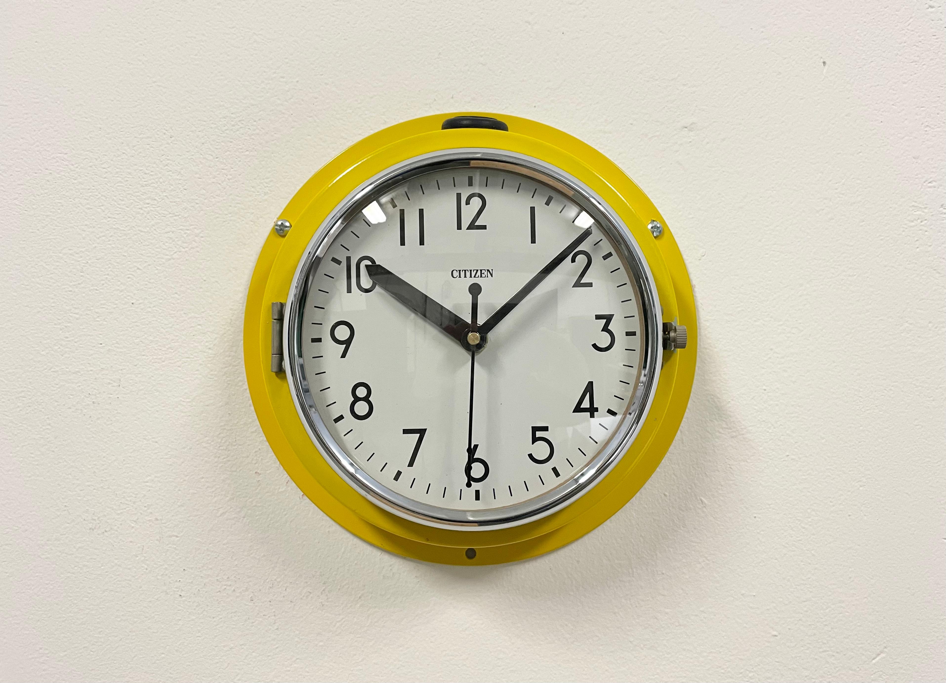 Vintage Citizen navy slave clock designed during the 1970s and produced till 1990s. These clocks were used on large Japanese tankers and cargo ships. It features a yellow metal frame, a plastic dial and curved clear glass cover. This item has been