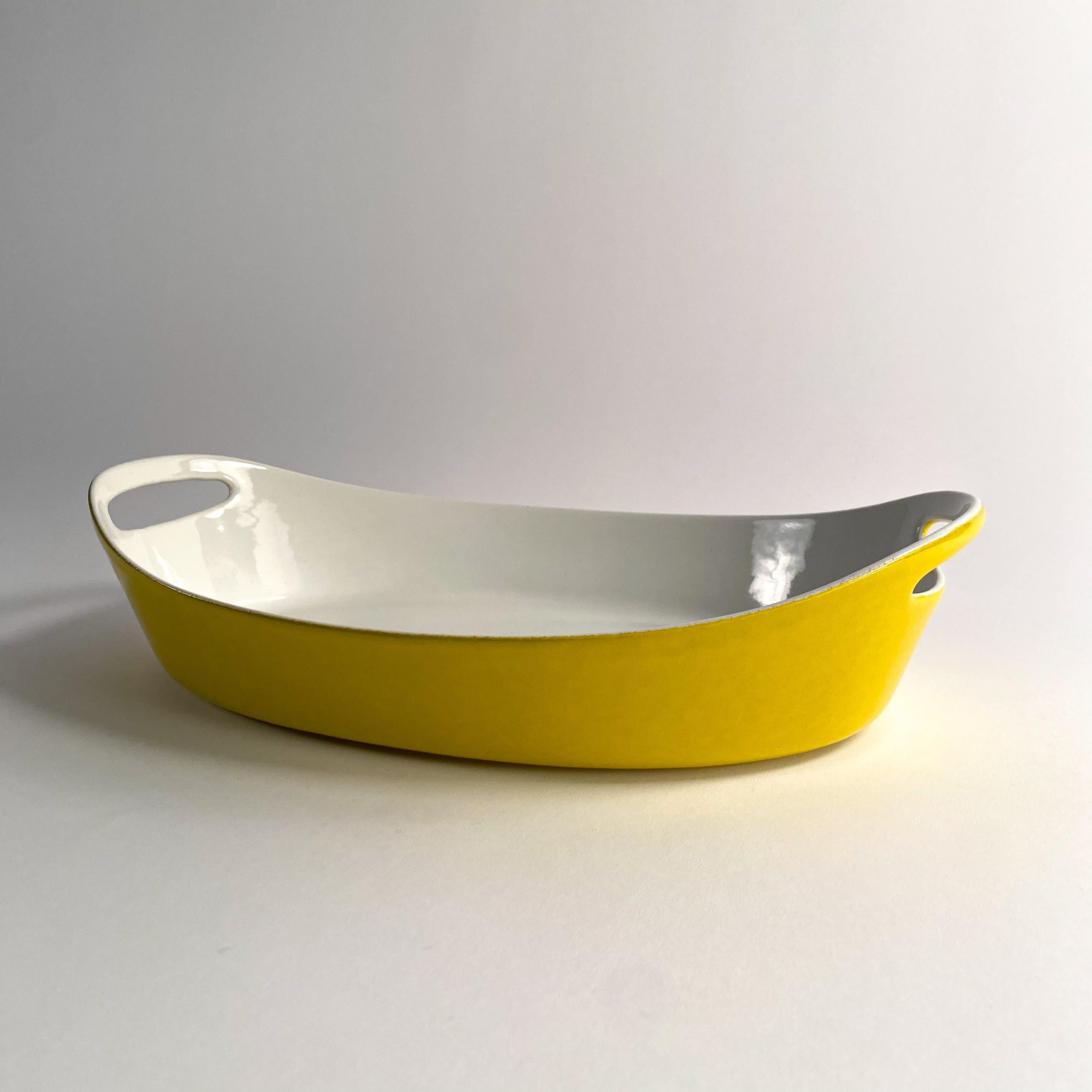 beautiful yellow enameled castiron casserole dish by Michael Lax for Copco. please see photos for condition details. 