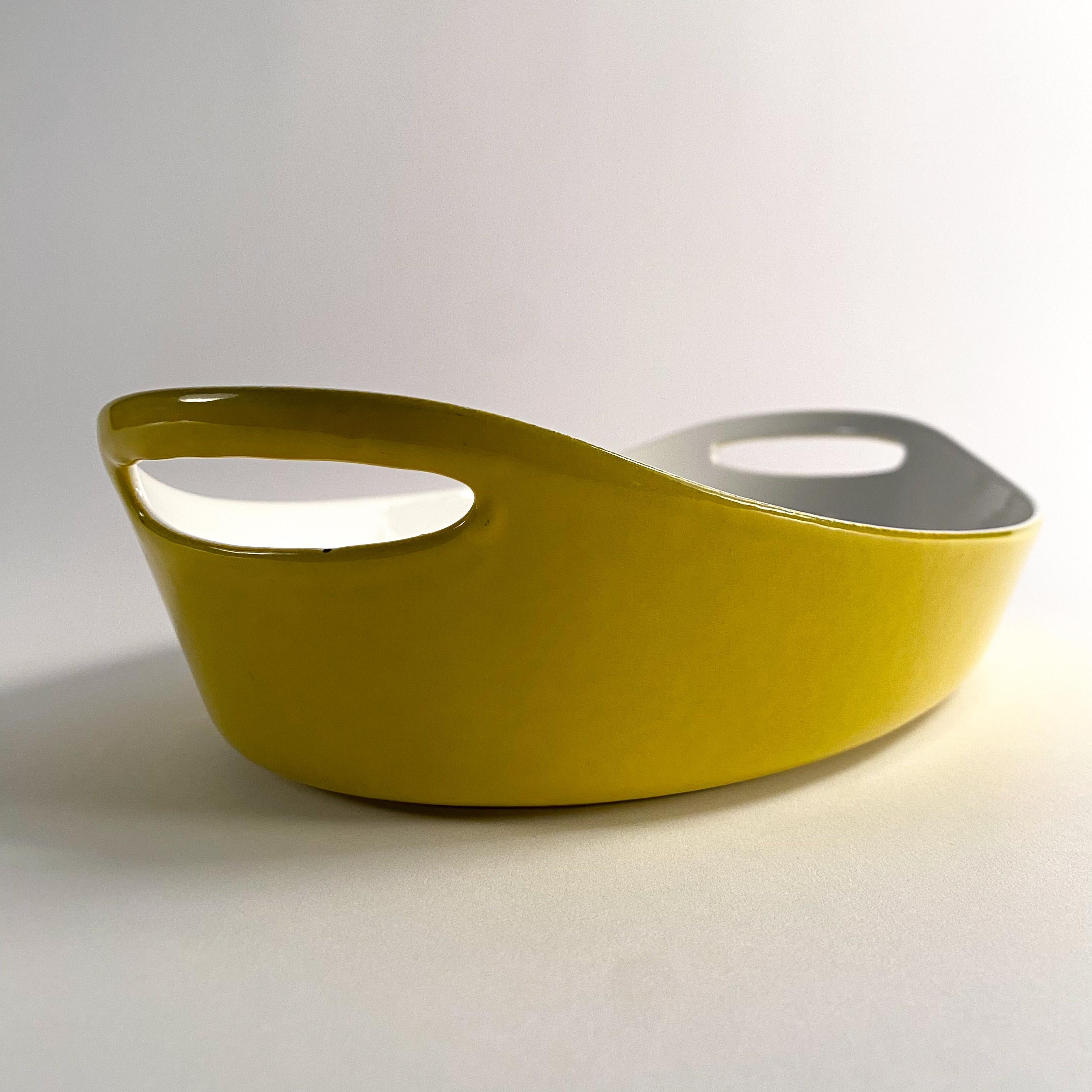 Late 20th Century vintage yellow enameled castiron casserole dish by Michael Lax for Copco For Sale