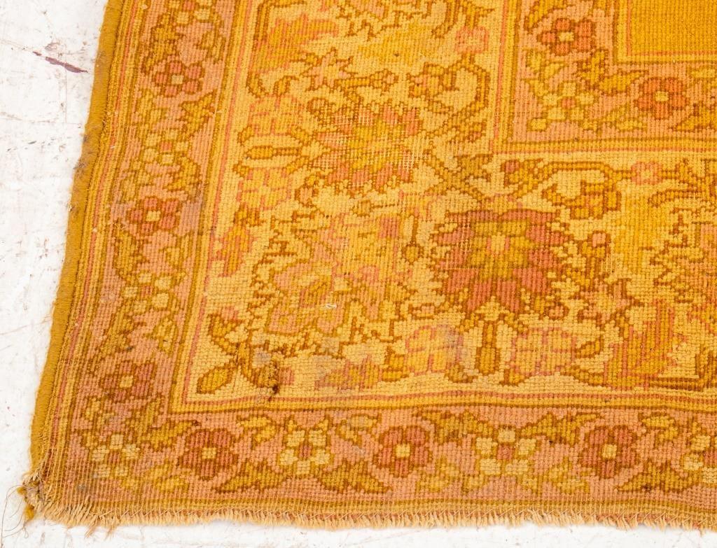 Vintage mustard yellow rug with a repeating floral pattern border. 

Dealer: S138XX