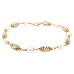 Vintage Yellow Gold Alternated Pearl 
Tonneau Spiral Grooved Bead Bracelet