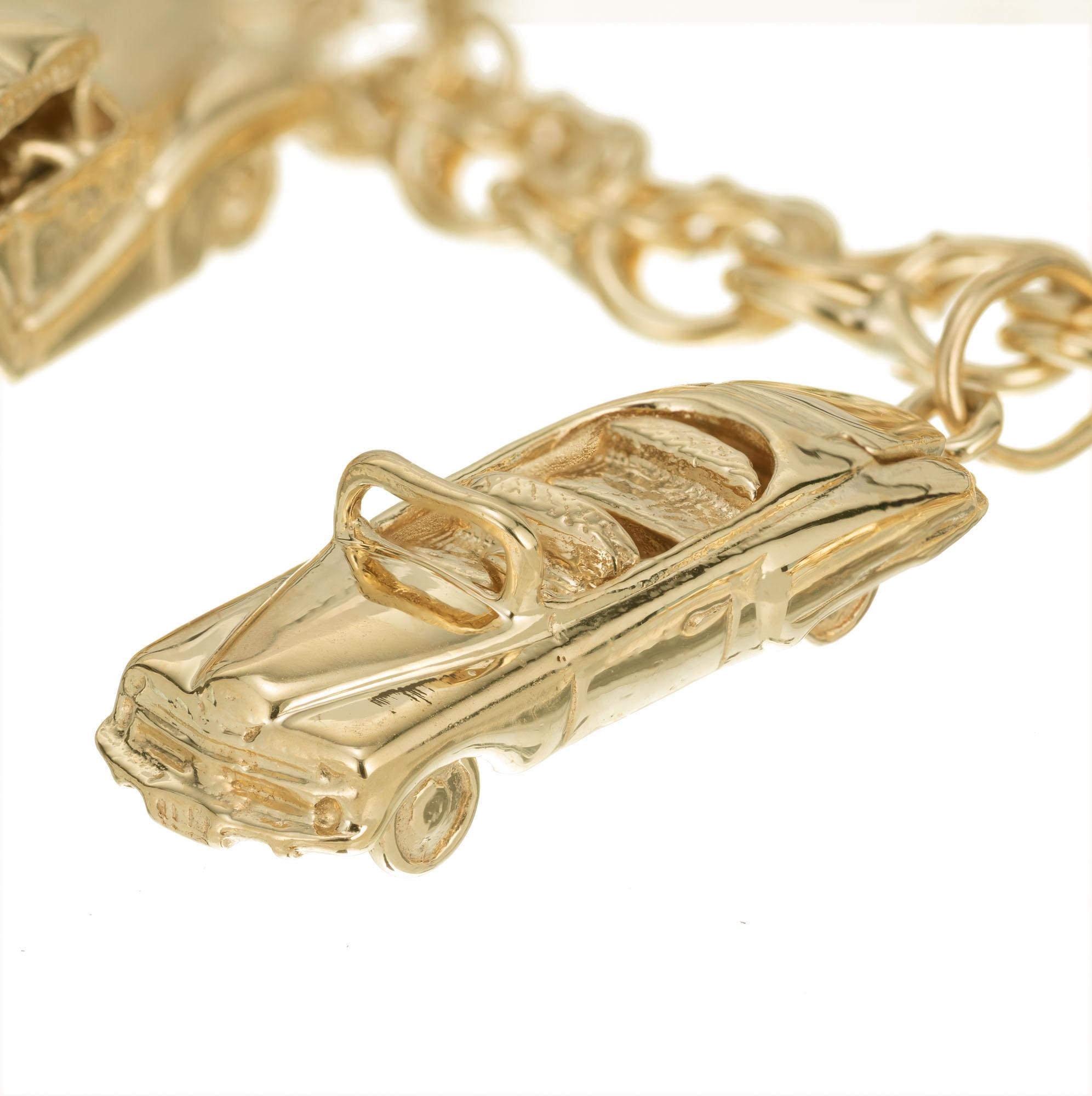 Six car 14k yellow gold charm bracelet. Open double spiral link with a later lobster catch. 7 inches in lengh.

14k yellow gold 
Stamped: 14k
38.1 grams
Bracelet: 7 Inches
Width: 7.1mm
Thickness/ depth: 3mm
