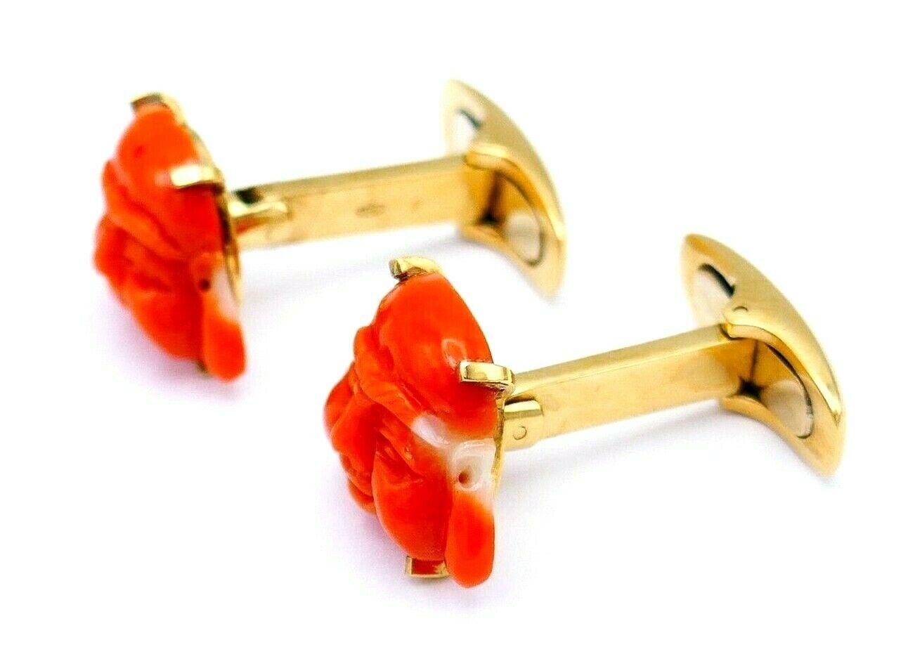 A pair of vintage cufflinks made of 18k yellow gold and carved coral depicting the laughing Buddha which is considered as a symbol of happiness and abundance. Stamped with a hallmark for 18k gold and a maker's mark.
Measurements: 5/8