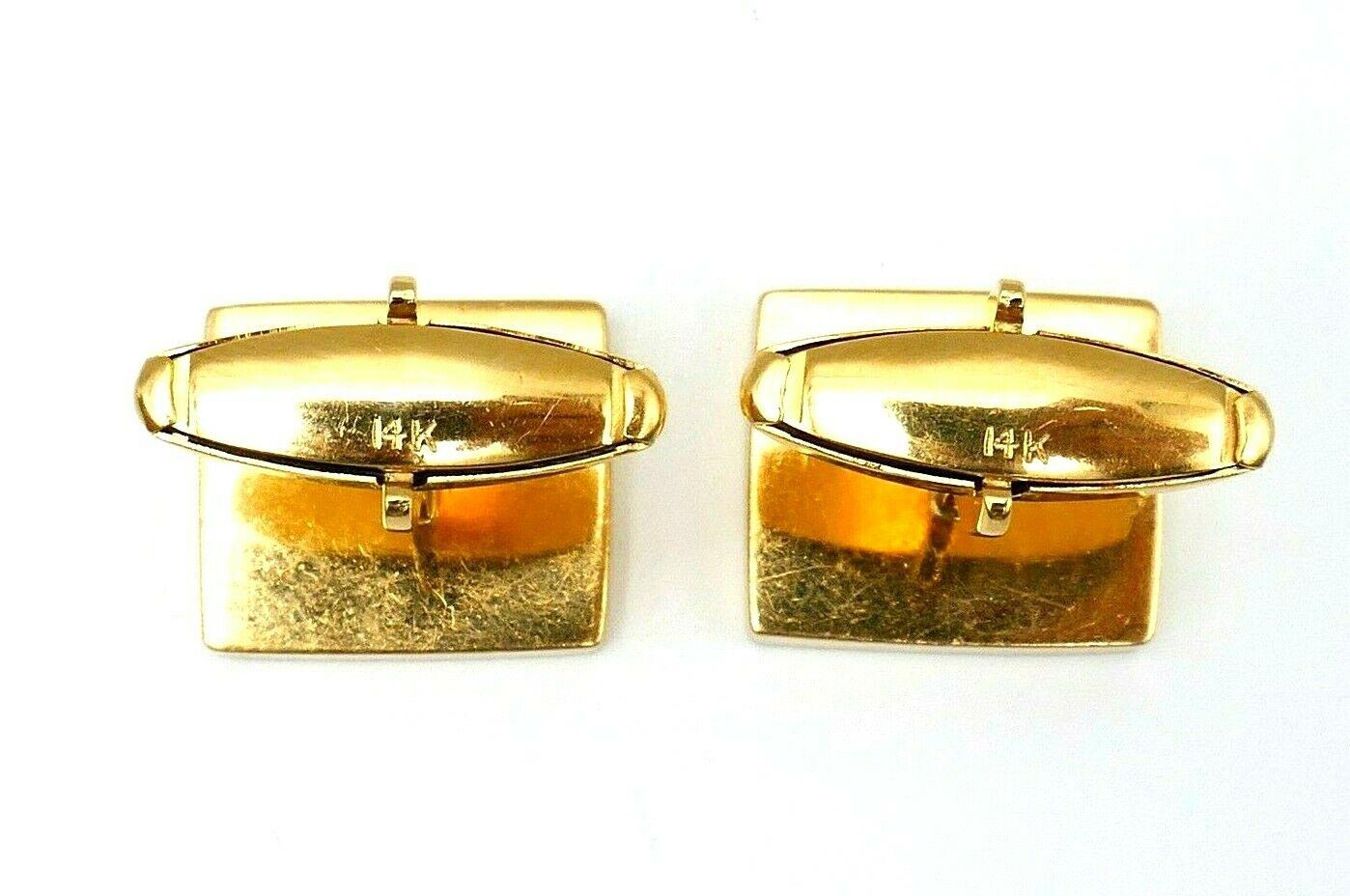 Vintage rectangular unisex cufflinks made of 14k yellow gold features polished coral. Stamped with a hallmark for 14k gold.
Measurements: the front part is 11/16