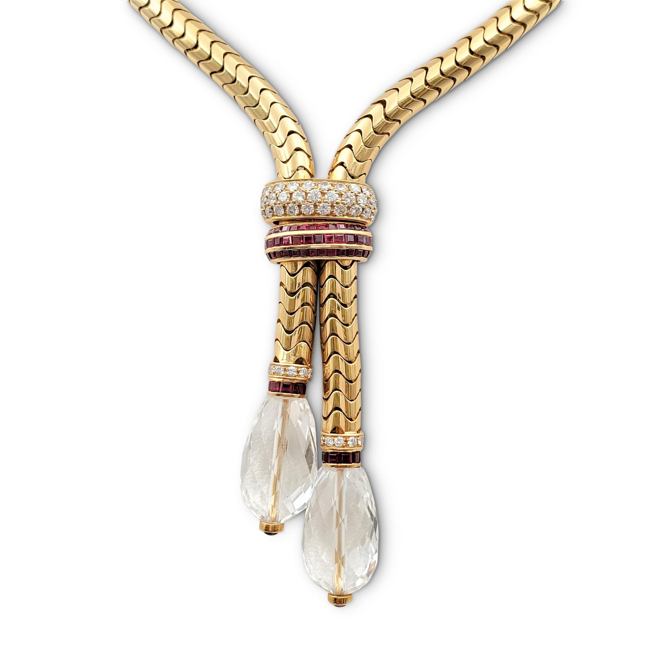 An enchanting necklace illustrating a lariat style crafted in 18 karat yellow gold. The substantial snake chain features a stationary enhancer set with one section of an estimated 0.95 carats of round brilliant cut diamonds and another set with an