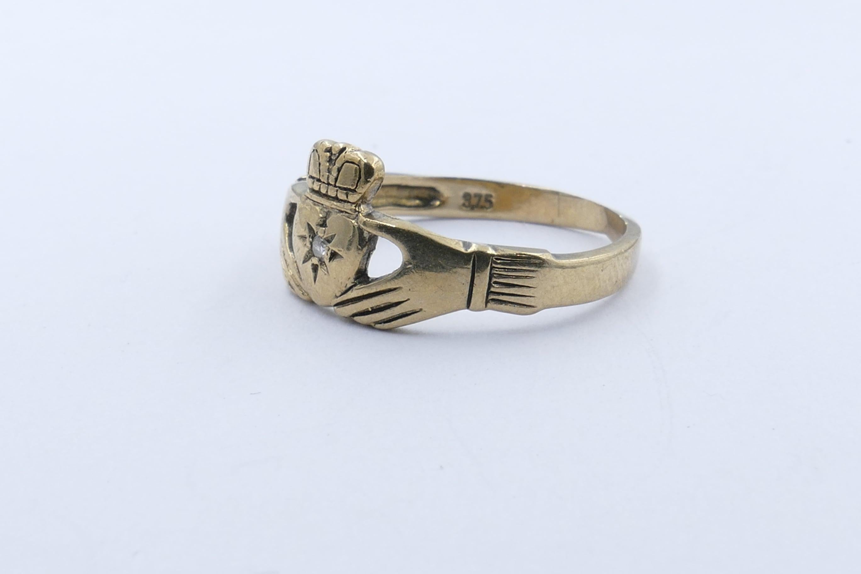 This is a rather special Claddagh Ring (known traditionally as the Irish Wedding Ring) made from 9 carat Yellow Gold because it feature a Diamond of good quality as its centrepiece.
The colour is H & clarity SI1 & bead/bright star set.
Finger Size