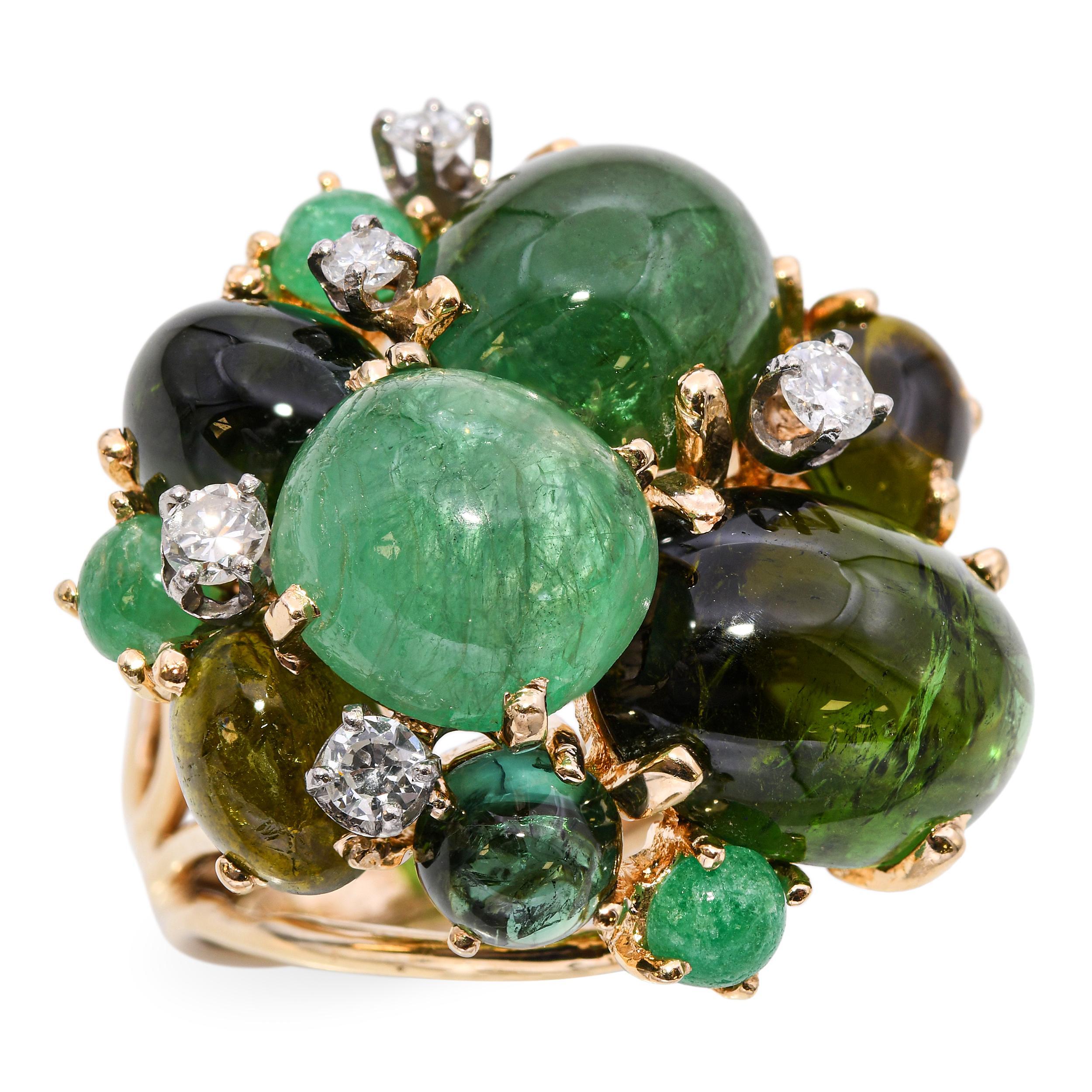 This vintage cluster ring exudes refined character with its harmonious arrangement of vibrant gemstones. At its heart, richly hued tourmaline is surrounded by a balanced display of diamonds and emeralds, creating a captivating mix of color and