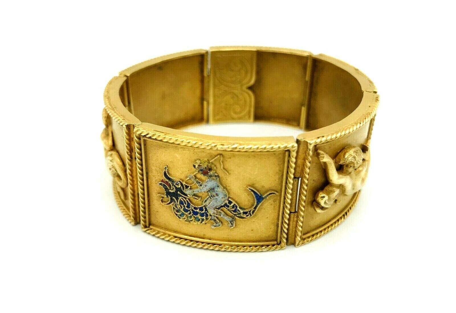 A gorgeous sectional Vintage bracelet made of 18k yellow gold. 
Features three embossed and three enamel figures portraying mythological creatures. 
Each section stamped with a hallmark for 18k gold (on a back). 
Measurements: 7.5
