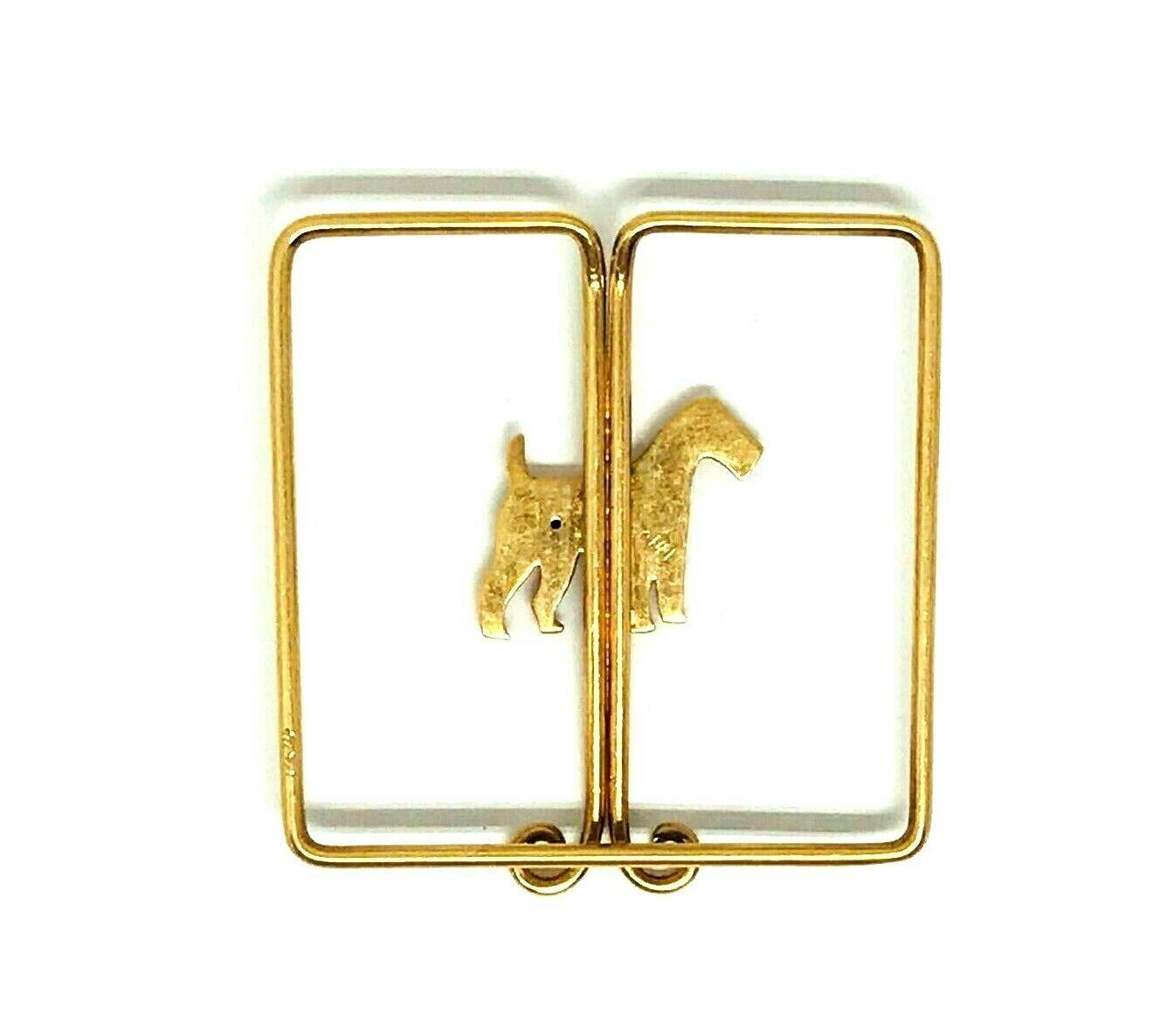 14k yellow gold money clip featuring a dog figure with a tiny ruby eye, wearing an enamel collar. A fine and stylish vintage accessory from 1970s. Stamped with a hallmark for 14k gold.
Measurements: the clip is 1 1/2