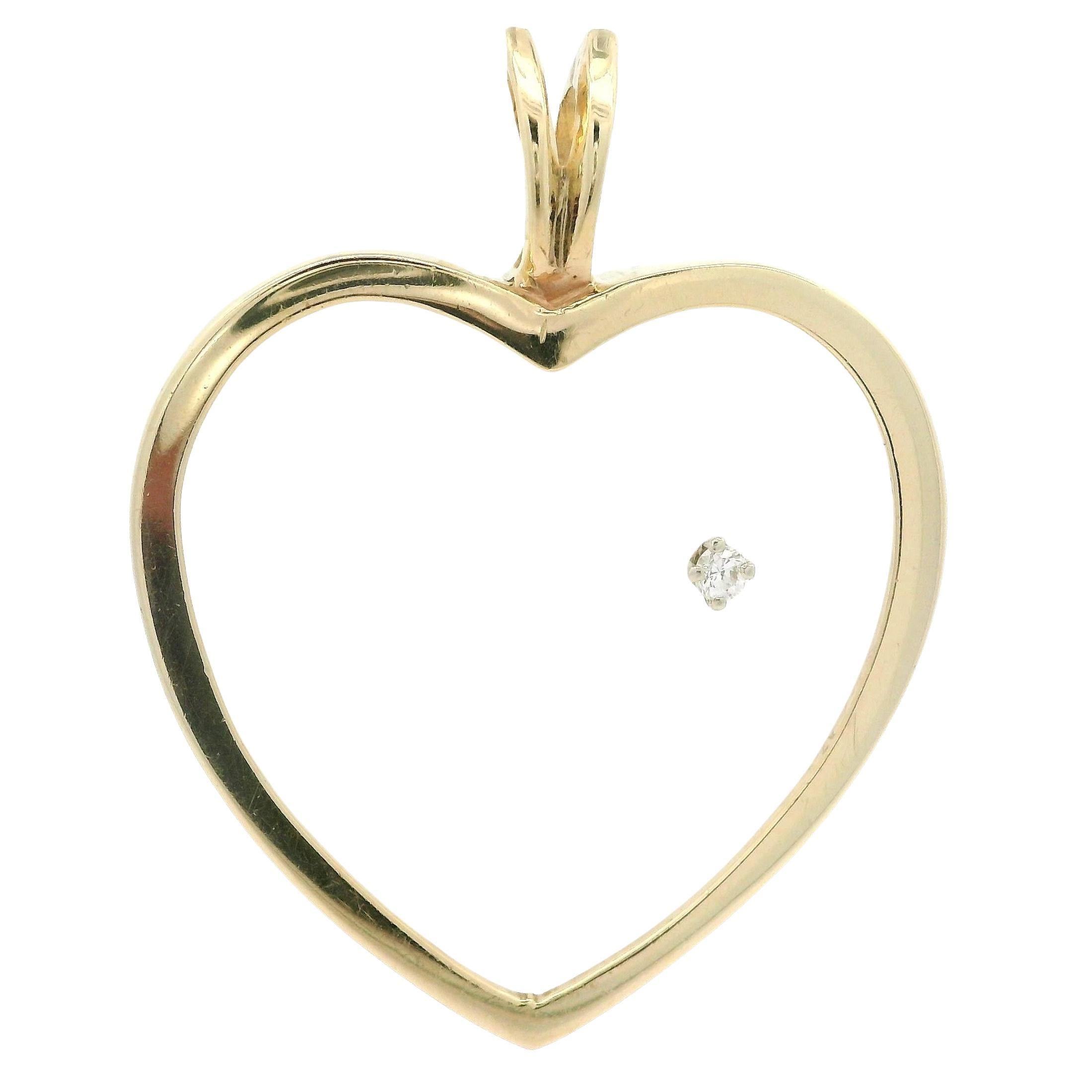 Herzanhänger aus Gelbgold mit mattiertem Glas und Quarz und Diamant in Herzform
