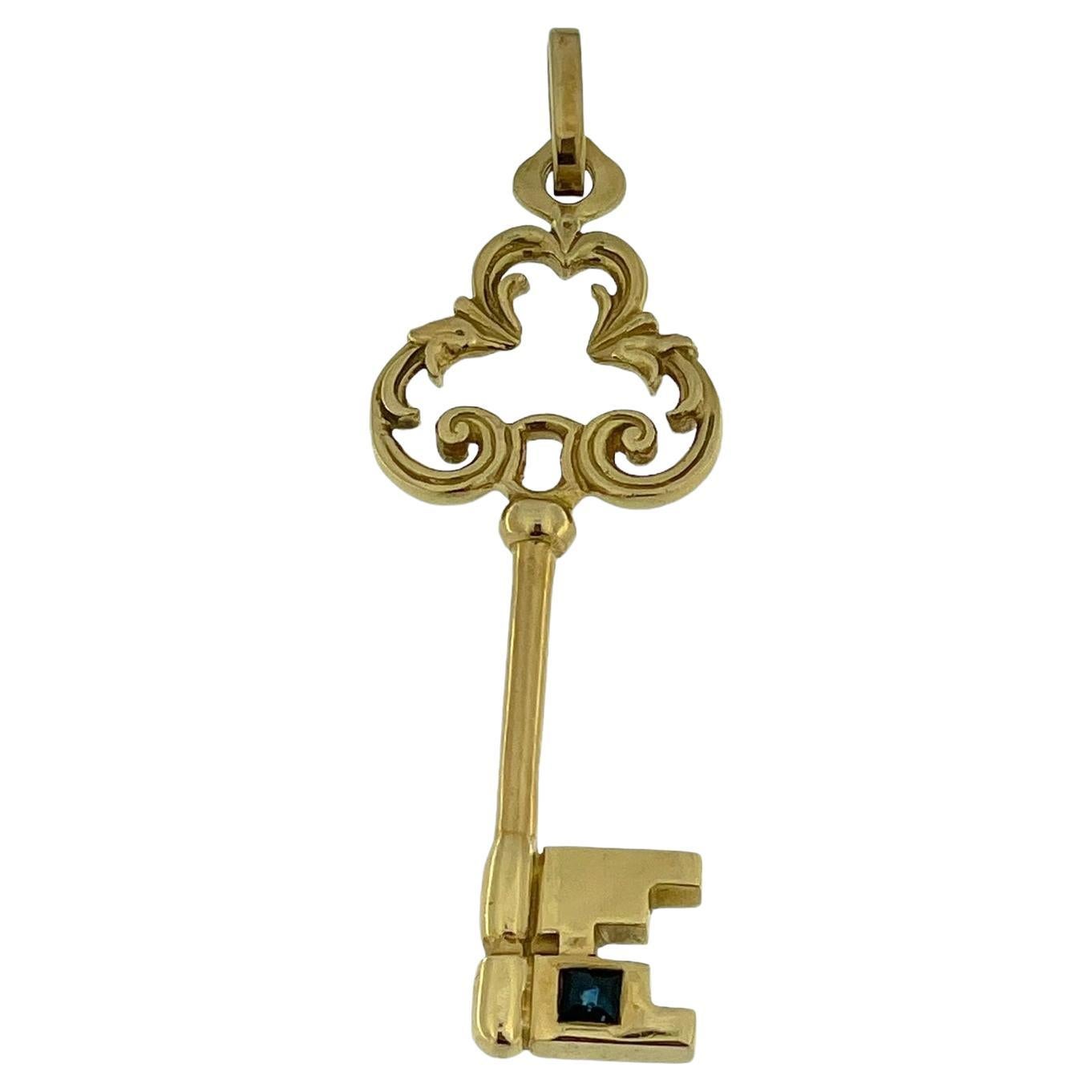 Vintage Yellow Gold Key Pendant with Sapphire For Sale