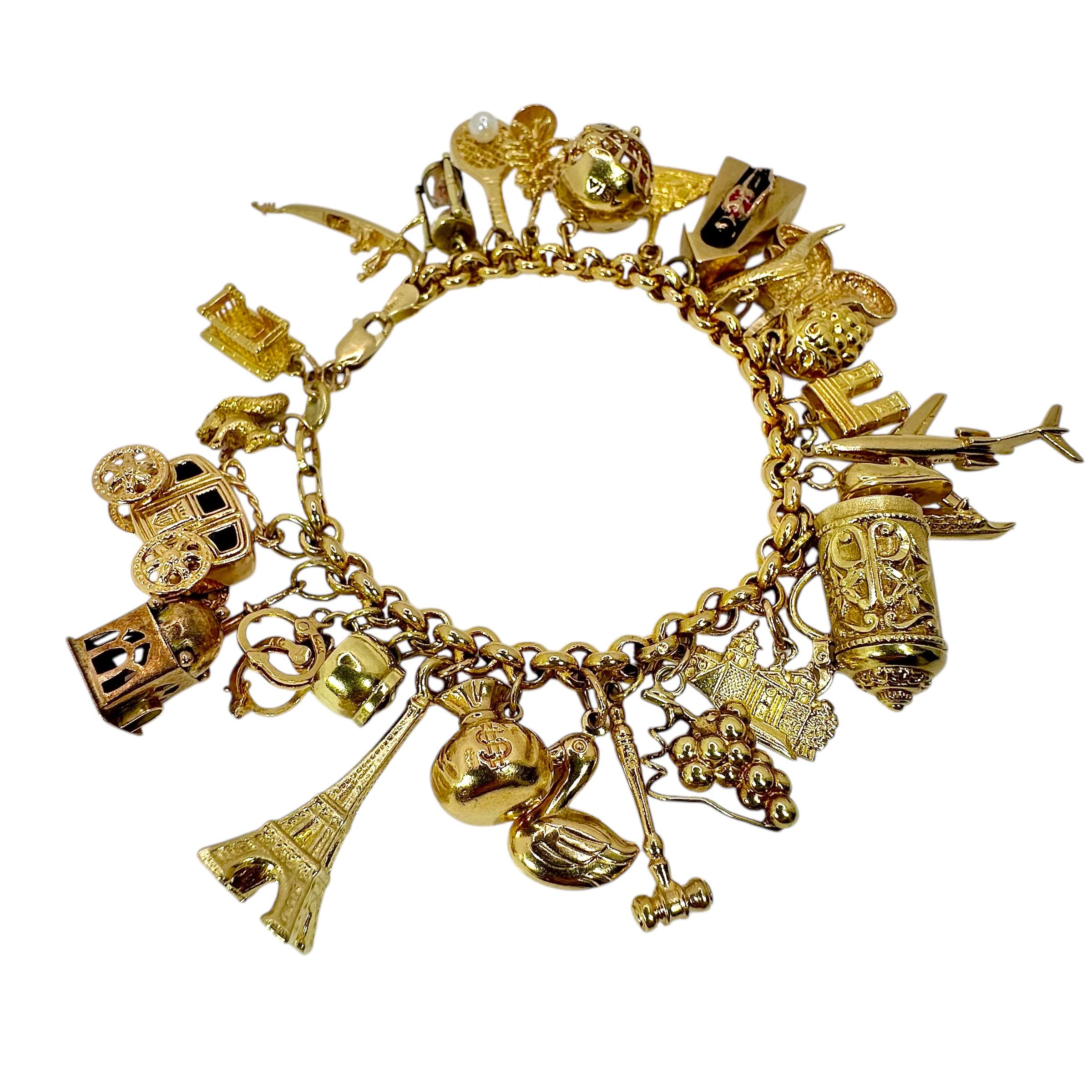 Vintage Yellow Gold Mid-Century Charm Bracelet with 27 Charms In Good Condition For Sale In Palm Beach, FL