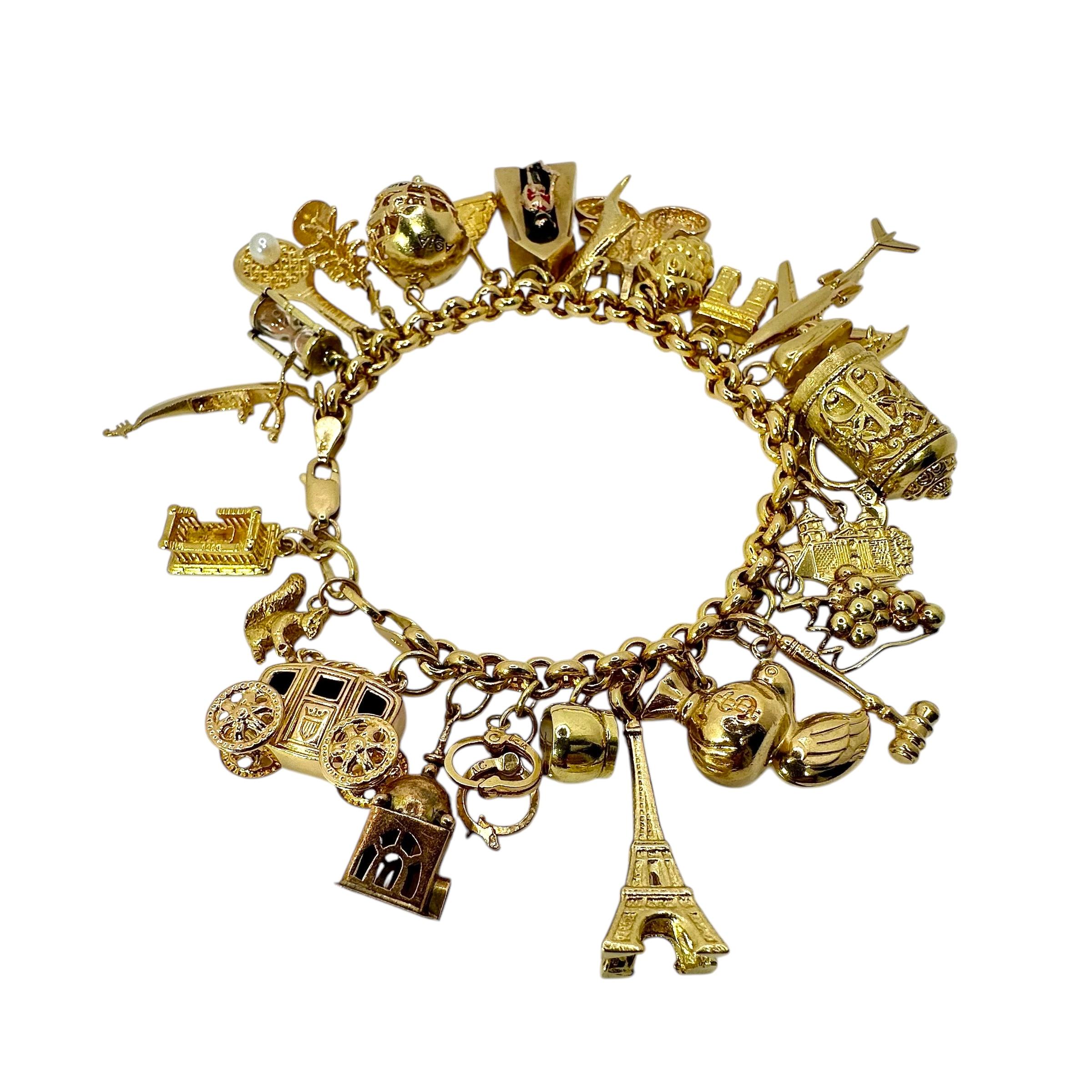 Women's or Men's Vintage Yellow Gold Mid-Century Charm Bracelet with 27 Charms For Sale