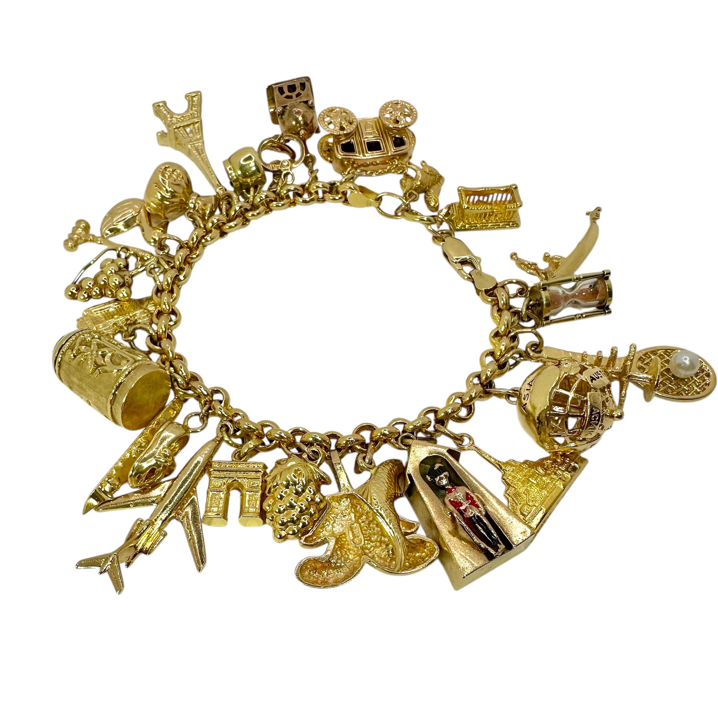 Vintage Yellow Gold Mid-Century Charm Bracelet with 27 Charms For Sale 3
