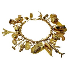 Vintage Yellow Gold Mid-Century Charm Bracelet with 27 Charms