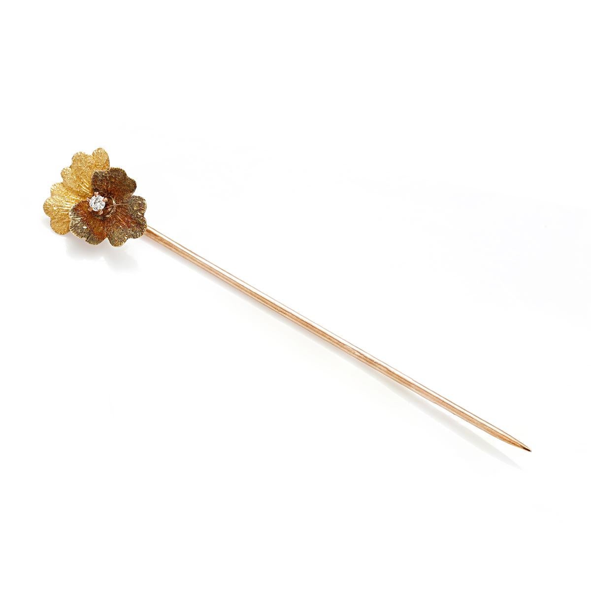 Vintage 18 karat yellow gold stick pin
Yellow and brown enamel orchid 
Set with 0.03 carat center diamond 
Period 20th century 

