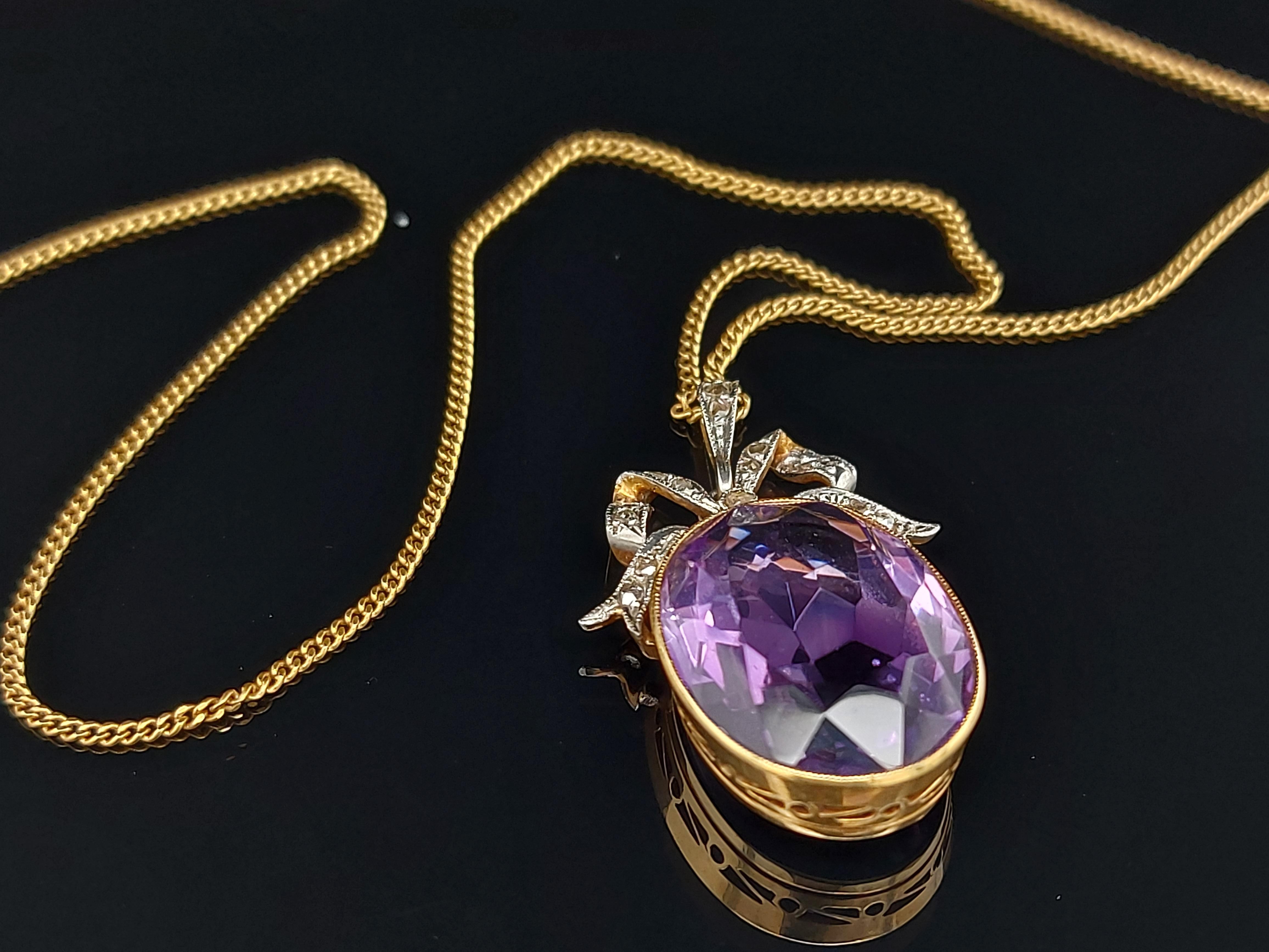 White and Yellow Gold Pendant Necklace With Big Amethyst and Rose cut Diamonds 

Diamonds: 17 rose cut diamonds

Amethyst: Length 13.7 mm x Height 18 mm

Material: 18 kt yellow and white gold

Measurements: Length 19.2 mm x Height 31 mm x Width 8
