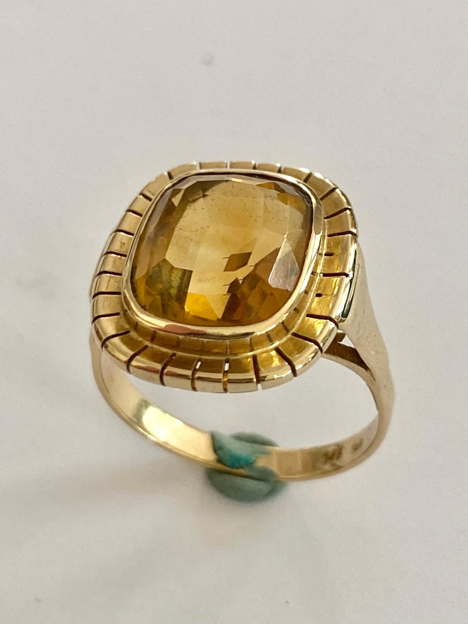 One (1) 14 Karat yellow Gold Ring stamped: 14K. 
Set with one (1) Natural Quratz Citrine  Center Stone.  = 5.10 Carat.  (Intense Orangy Yellow)  (heated)
Made in the USA ca 1965
Size: 17.75  ( 55.5)   USA: 7.5   UK :  O+
The ring is in a very good