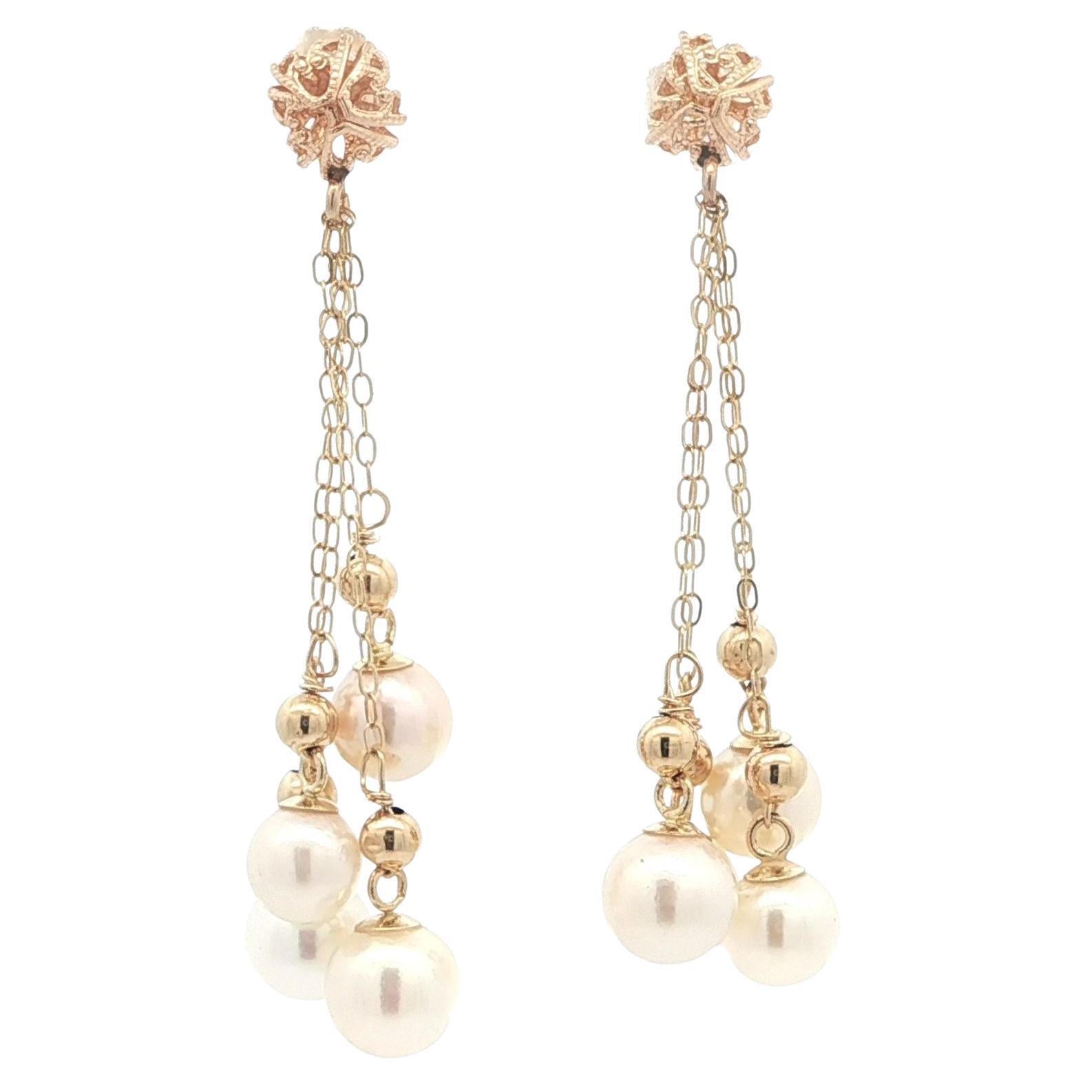 Orecchini vintage in oro giallo con perle bianche rotonde e pendenti con nappina