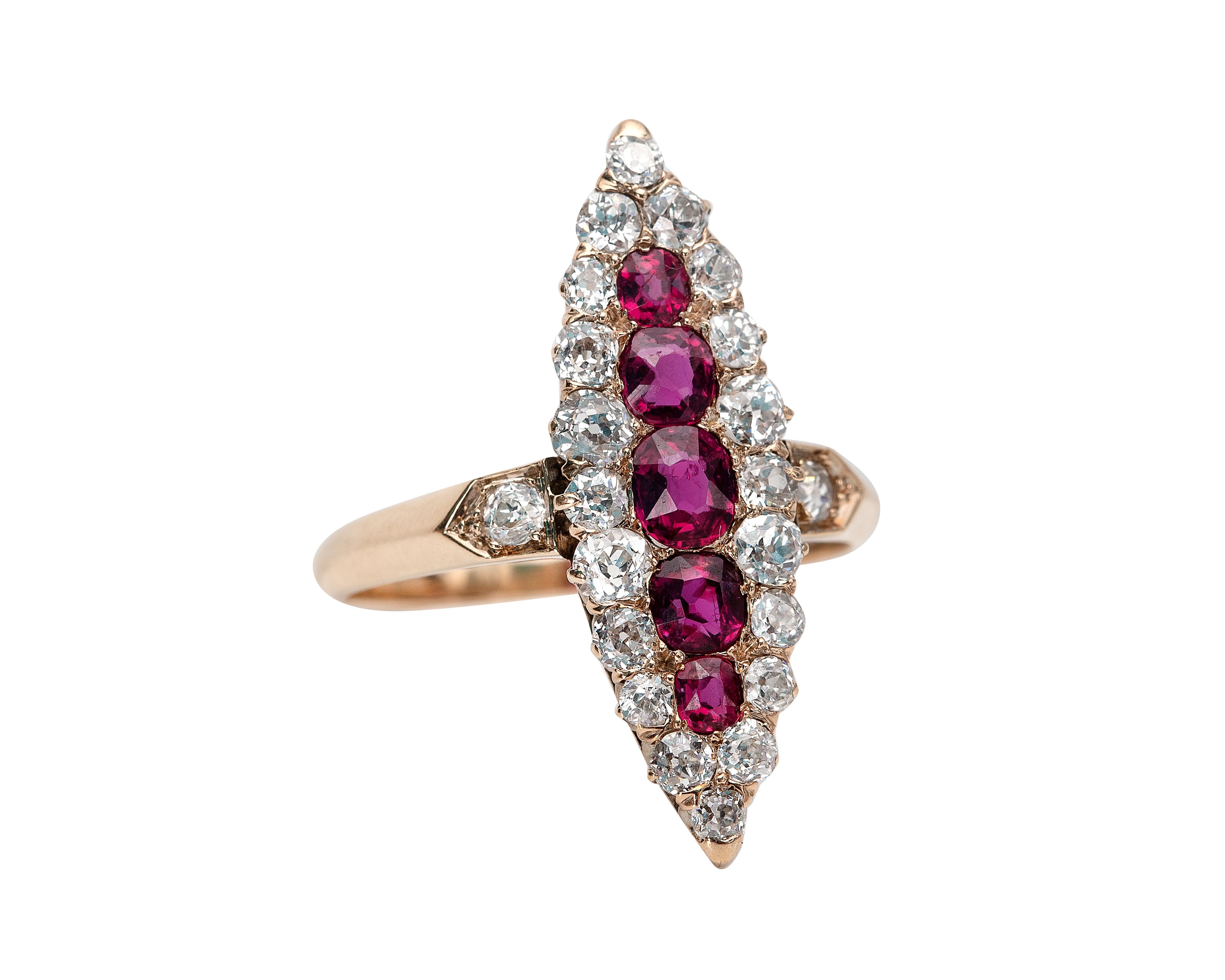 This is an exquisite example of a victorian navette marquise-shaped ring. It is crafted in yellow gold and the center features 5 pigeon blood red rubies of the finest quality. The rubies are surrounded by 1 carat of impeccable old miner cut