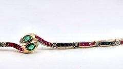 Vintage Yellow Gold Snake Bracelet with Emeralds, Rubies, and Diamonds