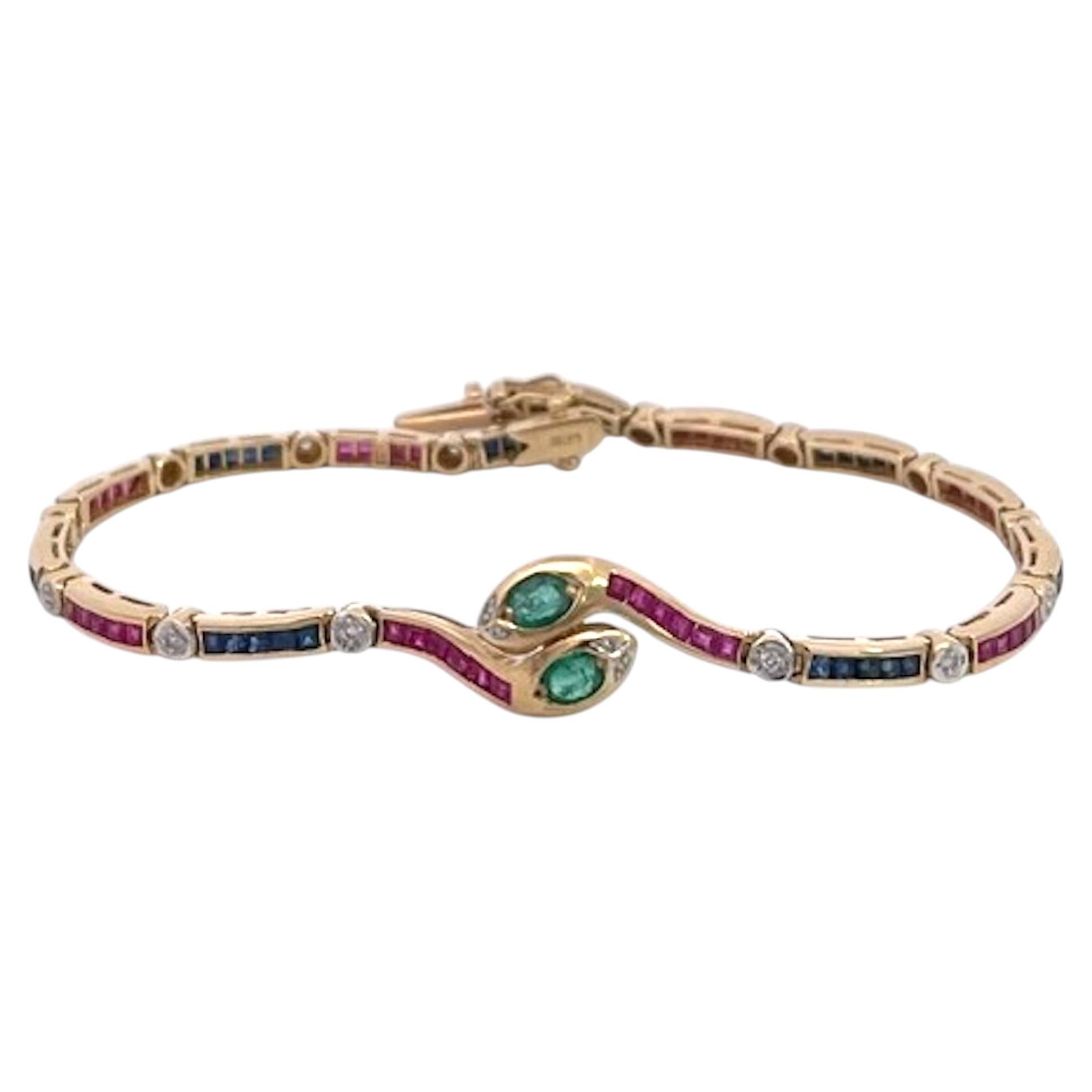 Bracciale vintage a forma di serpente in oro giallo con smeraldi, rubini e diamanti