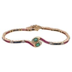 Vintage Yellow Gold Snake Bracelet with Emeralds, Rubies, and Diamonds