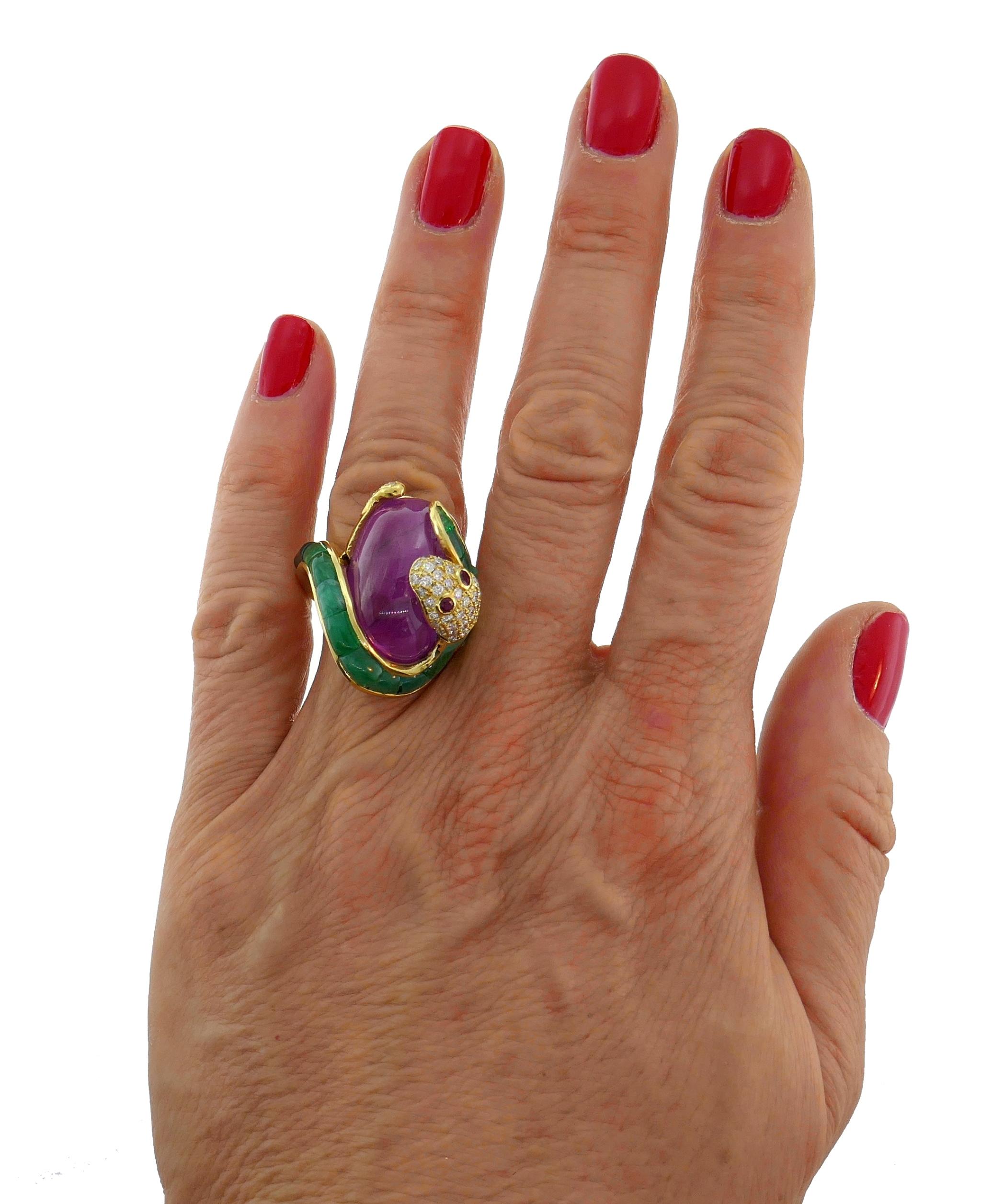 Bold and articulated cocktail ring created in the 1980s.
Made of 18 karat (tested) yellow gold, cabochon ruby, pave set round brilliant cut diamonds (G-H color, VS clarity, 0.25 carat total), pre-cut emeralds and two round faceted