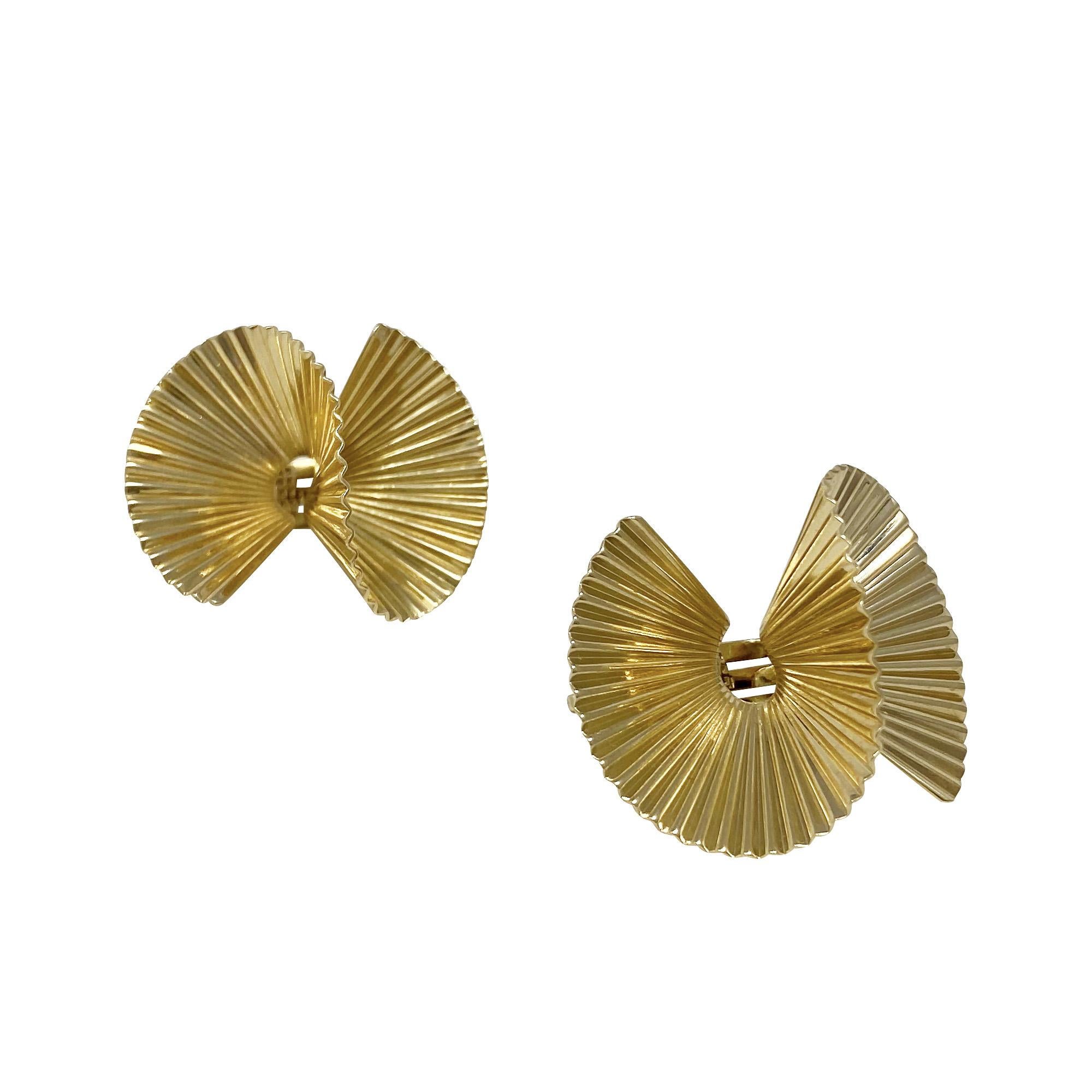 From a fabulous by-gone era!  In 14 karat yellow gold, these twisted and linear yellow gold earrings are secured with a clip back. 