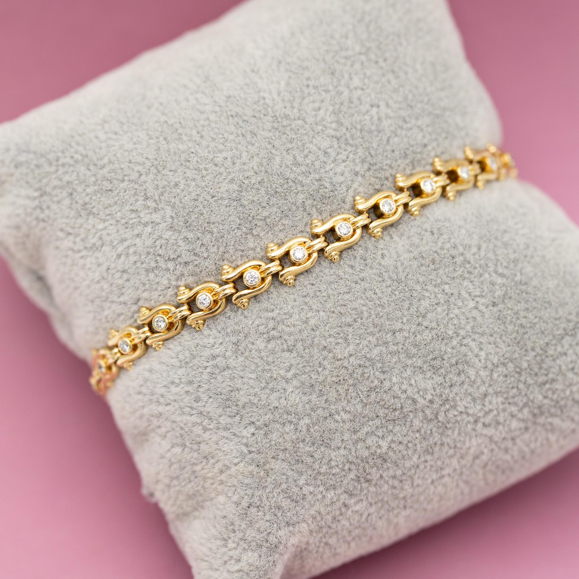 For sale is this royal and elegant vintage tennis bracelet. This bracelet is crafted in 18k yellow gold with and is hallmarked with a 750 mark. Twenty-five brilliant cut diamonds ensure its elegant look and royal appearance. They combine for a total
