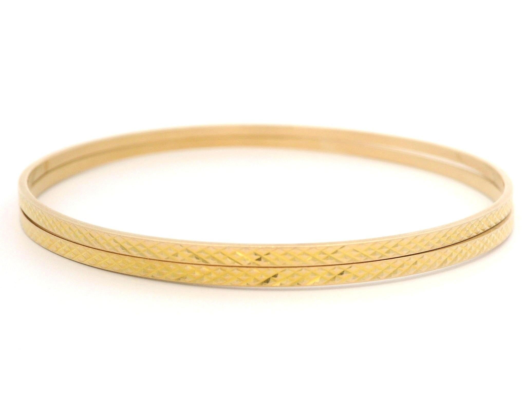 Material: Solid 18K Yellow Gold
Weight: 10.8 Grams (weight of the pair)
Type: Pair of Slip On Bangle Bracelets
Inner Diameter: 56.8mm ((2.2