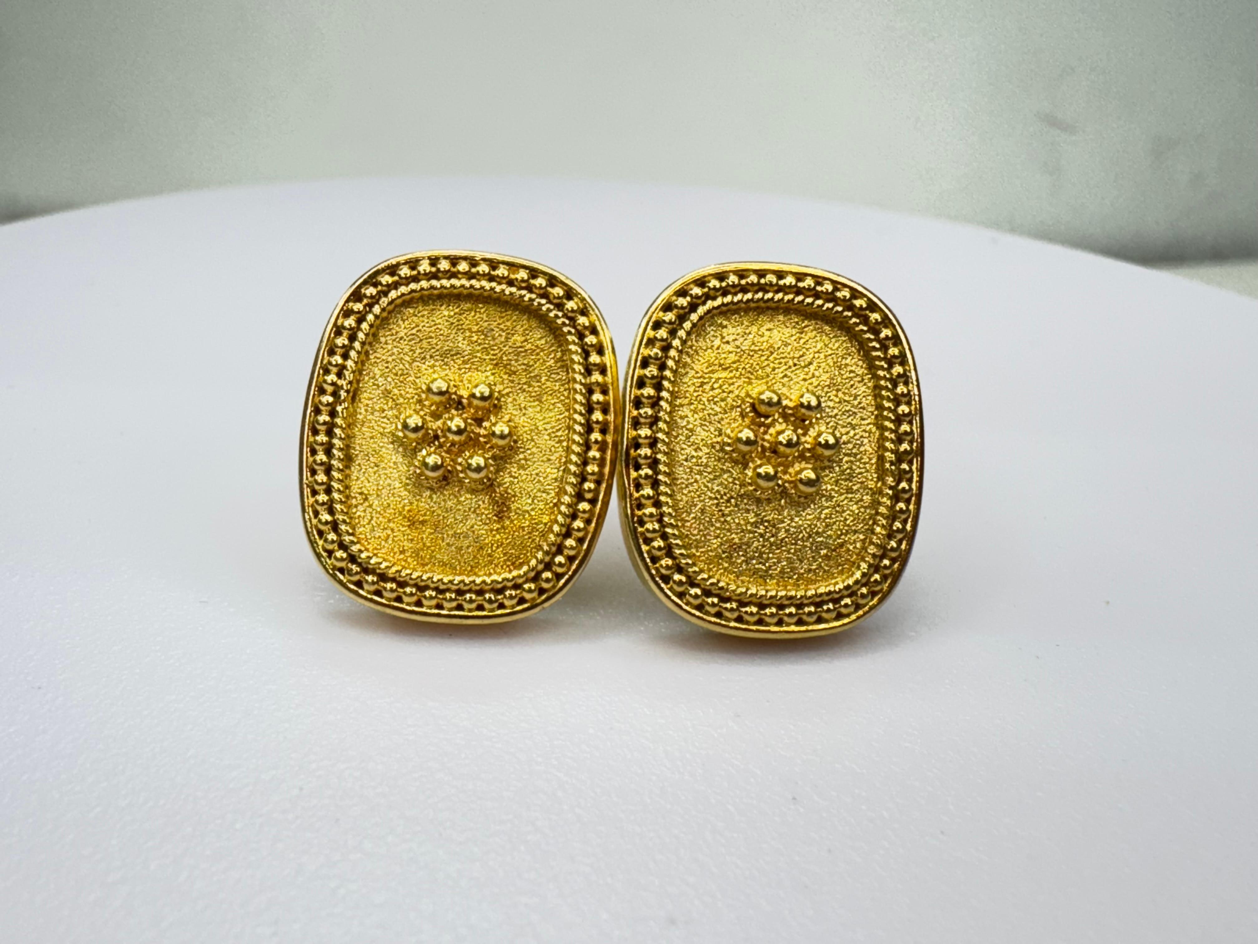 Inspired by the opulent artistry of the Byzantine Empire, which spanned from 300 AD to 1453 AD, these vintage 18k yellow gold earrings reflect a legacy of intricate design and timeless beauty. Crafted in the late 20th century, they feature a richly