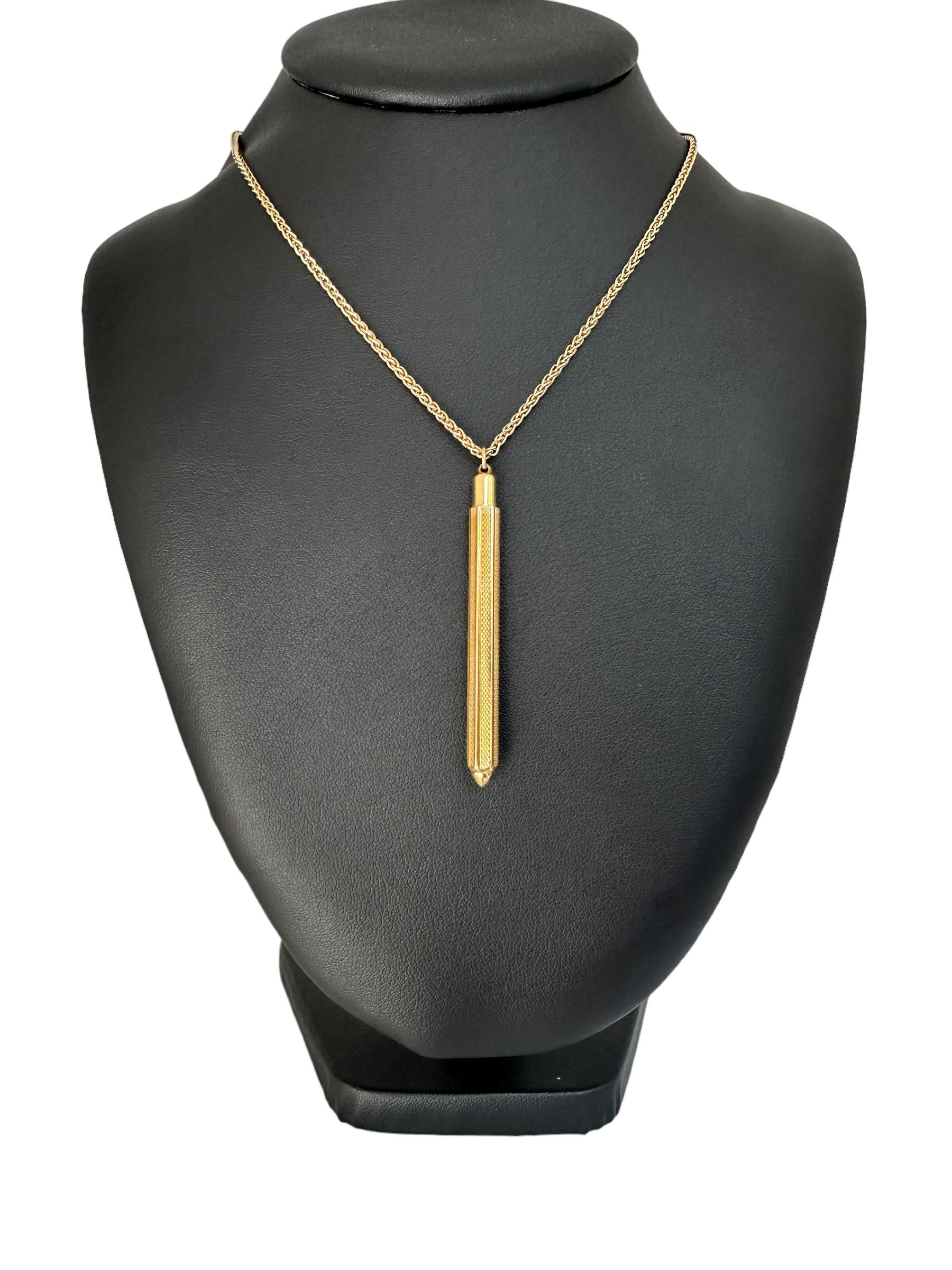This Vintage Yellow Gold Toothpick Pendant is a unique and intriguing piece of jewelry that combines practicality with exquisite craftsmanship. Crafted from luxurious 18-karat yellow gold, this pendant dates back to the 1930s, making it a remarkable